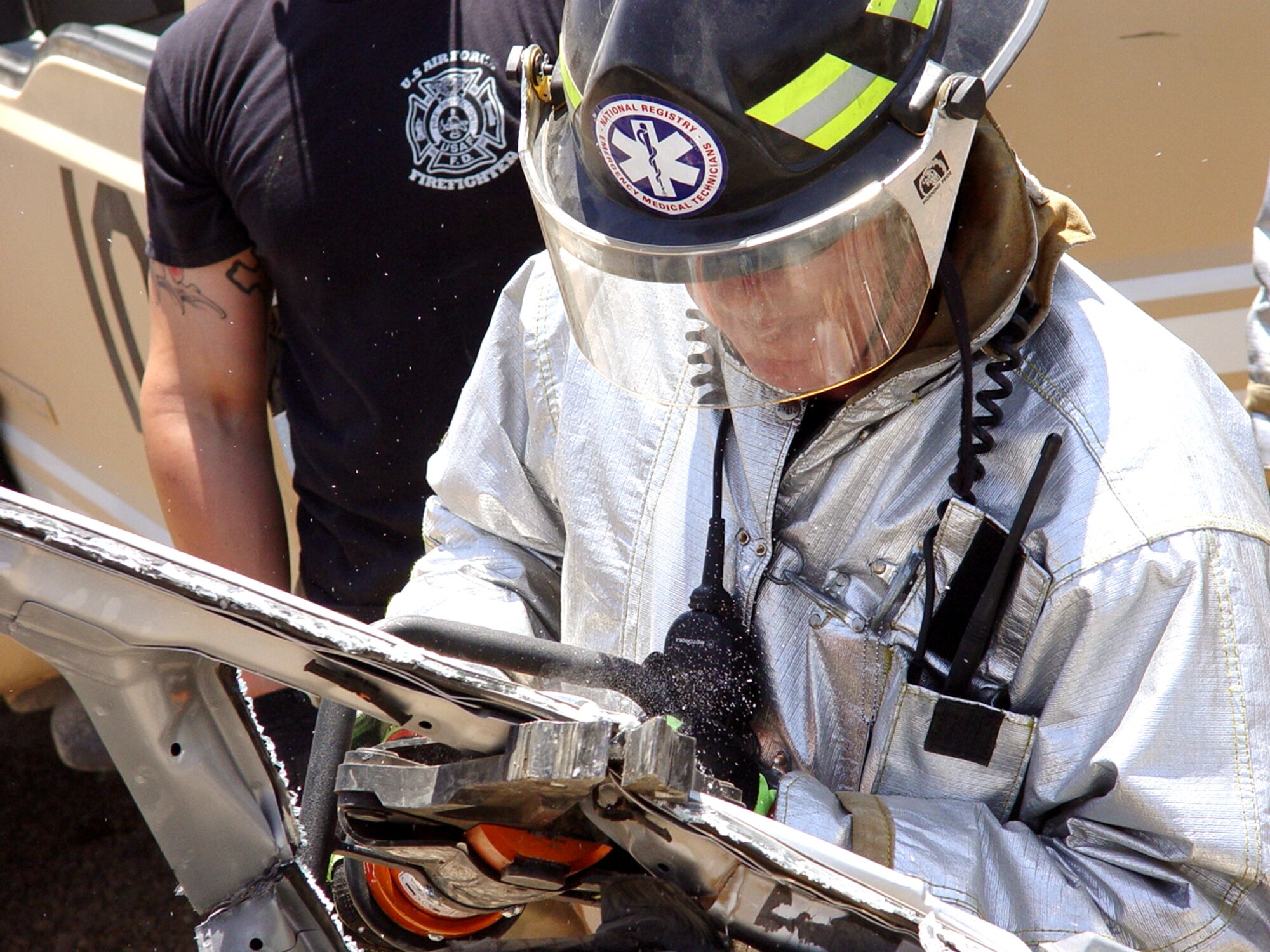 BALAD AIR BASE, Iraq -- Staff Sgt. Phillip Clark practices a vehicle extraction during an exercise here.  Firefighters train continuously so they are prepared for any emergency situation that arises.  Sergeant Clark is a firefighter with the 332nd Expeditionary Civil Engineer Squadron.  (U.S. Air Force photo)

                  