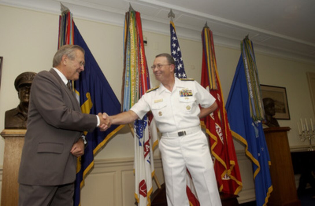 Secretary of Defense Donald H. Rumsfeld (left) congratulates the new Vice Chairman of the Joint Chiefs of Staff Adm. Edmund P. Giambastiani Jr., U.S. Navy, in the Pentagon on Aug. 12, 2005. Chairman of the Joint Chiefs of Staff Gen. Richard B. Myers, U.S. Air Force, administered the oath of office to Giambastiani as the 7th vice chairman succeeding Marine Gen. Peter Pace as the nation's second highest-ranking military officer. 