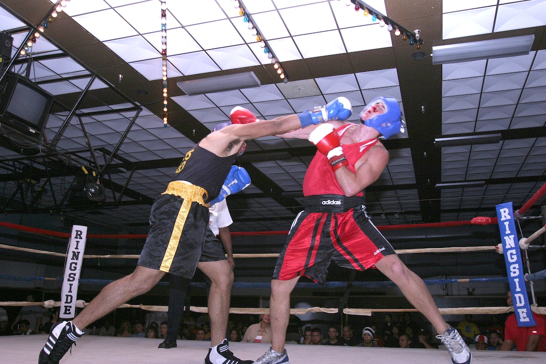 Fighters Unlimited Boxing Clubs, Francisco Maldonado stretches out to take a shot at his opponent Matthew Monkewicz, during the boxing tournament, Aug. 12, at Kahunas Bar & Grill Ballroom.