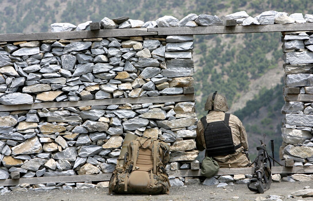 Lance Cpl. Alberto Lopez, infantryman with 2nd Battalion 3rd Marine Regiment, from El Paso, Texas, pauses during a patrol. Marines and sailors from 2nd Bn, 3rd Marines, together with the Afghan National Army, conducted security operations in the Korengal Valley August 10 through 20.