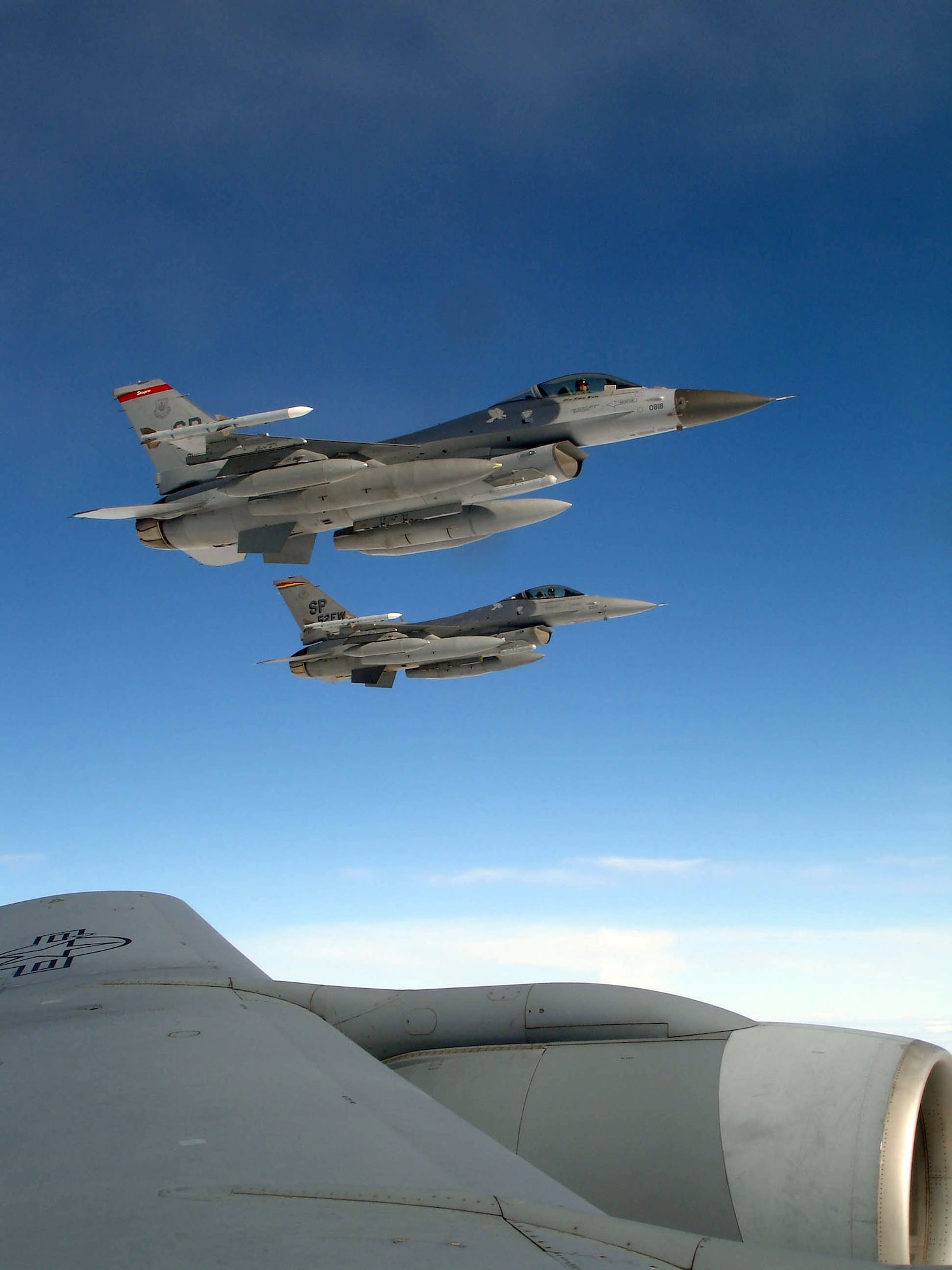 ZHUKOVSKY, Russia -- Two F-16 Fighting Falcons from Spangdahlem Air Base, Germany, await refueling from a KC-135 Stratotanker from Royal Air Force Mildenhall, England, en route to the Moscow International Aviation and Space Salon Aug. 14.  About 100 servicemembers are participating in the air show Aug. 16 to 21.  (U.S. Air Force photo by Tech. Sgt. Cindy Dorfner)

