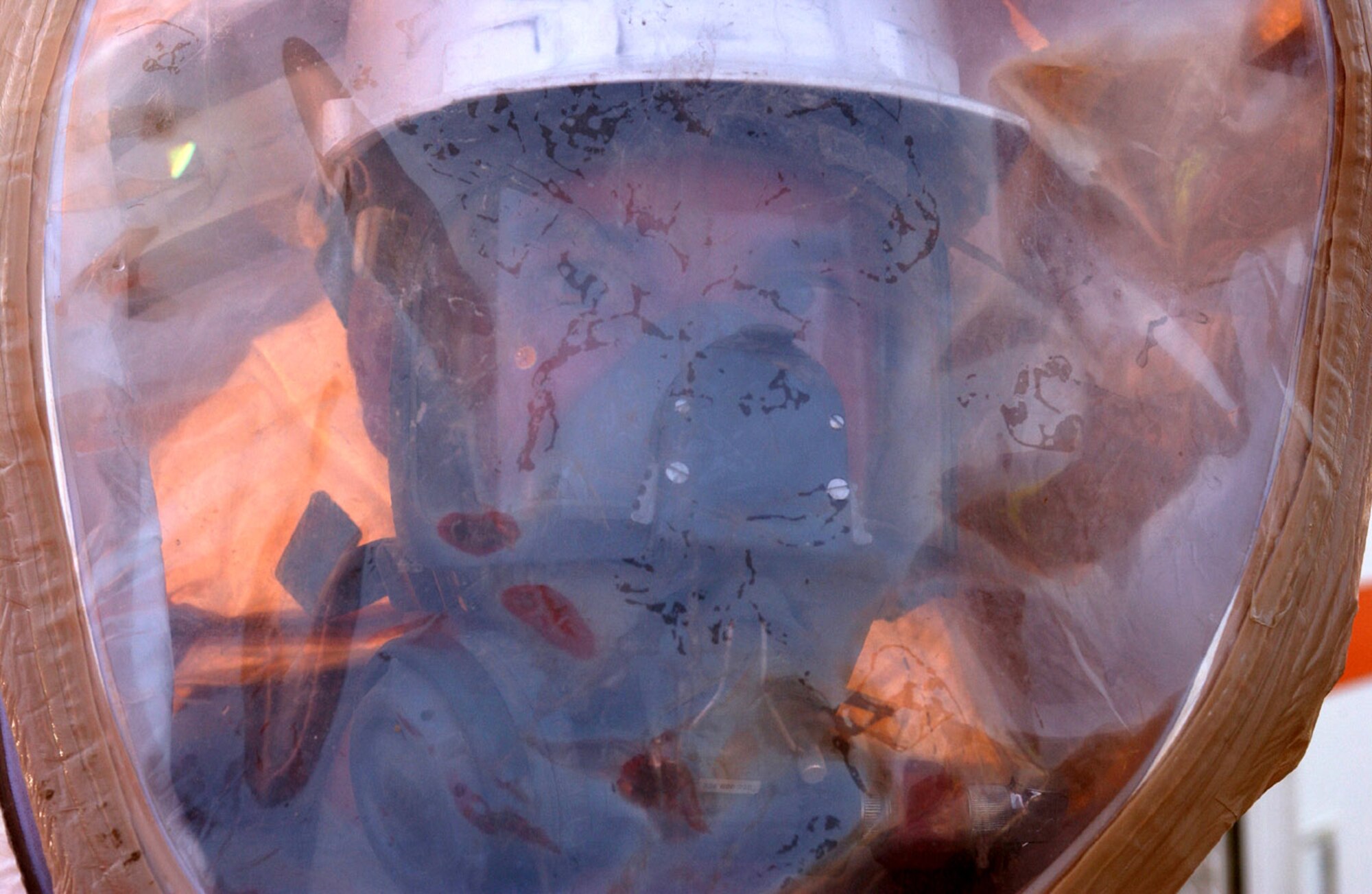 BAGHDAD, Iraq -- Airman 1st Class Matthew Metzger is fully encapsulated in a protective suit as he prepares to enter a hazardous incident exercise evaluation area here.  Airman Metzger is assigned to the 447th Expeditionary Civil Engineer Squadron and is deployed from Kadena Air Base, Japan.  (U.S. Air Force photo by Tech. Sgt. Brian Davidson)                            