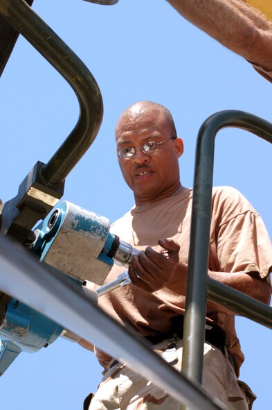 KARSHI-KHANABAD AIR BASE, Uzbekistan -- Tech. Sgt. Joe Hamlet tightens a bolt on a C-130 Hercules engine here. He is an engine mechanic with the 774th Expeditionary Airlift Squadron's maintenance flight and is deployed from the Mississippi Air National Guard. (U.S. Air Force photo by Staff Sgt. Shad Eidson)