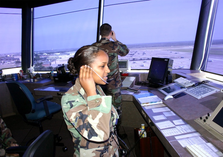 LAUGHLIN AIR FORCE BASE, Texas -- Airman Kelemwork Tariku-Shotts communicates with an aircrew on the flightline here.  Airman Tariku-Shotts was adopted and brought to United States from Ethiopia in 1991 when she was 5 years old.  She is an air traffic controller with the 47th Operations Support Squadron.  (U.S. Air Force photo by Airman 1st Class Owolabi Olufemi)