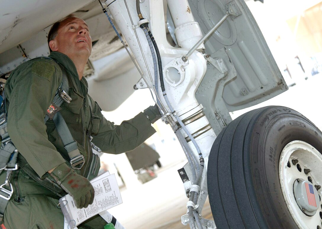 DAVIS-MONTHAN AIR FORCE BASE, Ariz. -- Col. Michael Spencer conducts a preflight inspection on an A-10 Thunderbolt before takeoff. He is the 355th Wing commander. (U.S. Air Force photo by Airman 1st Class Christina D. Ponte)