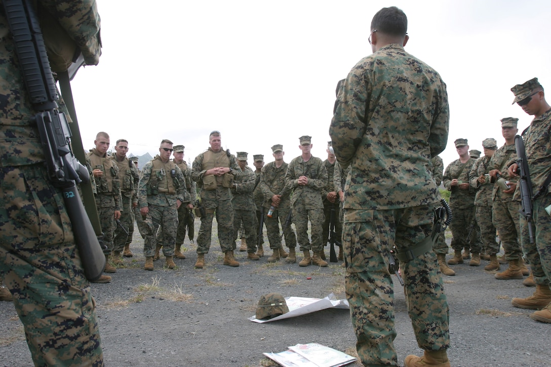 1st Lt. Ziad Fakhoury, platoon commander, Combined Anti-Armor Team Platoon, Weapons Company, 1st Battalion, 3rd Marine Regiment, conducts an after-action report with his Marines following a training evolution, Tuesday, at Marine Corps Training Area Bellows.