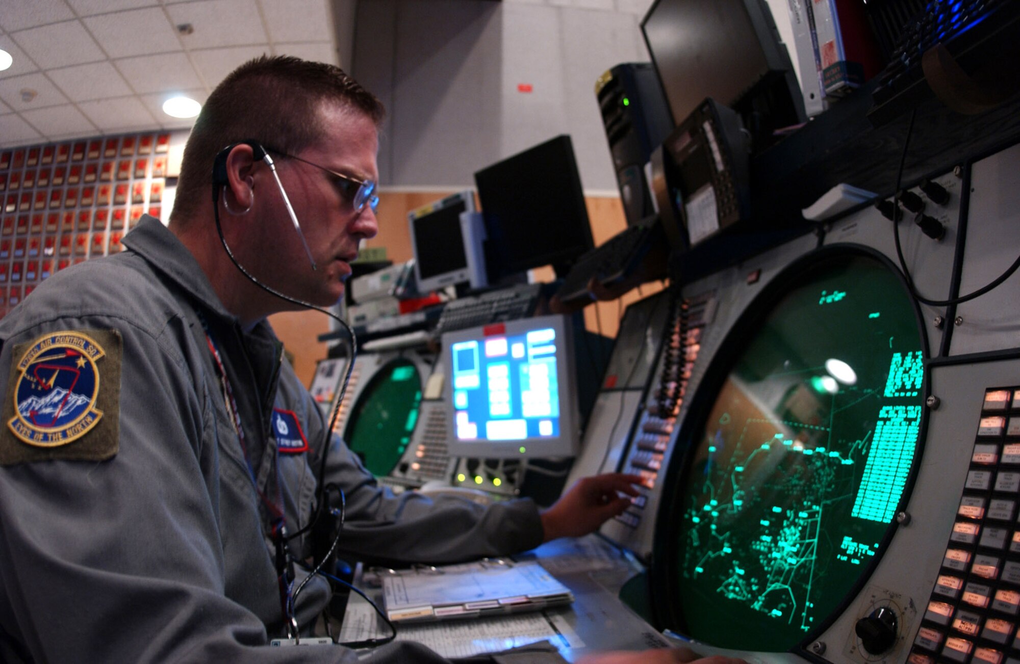ELMENDORF AIR FORCE BASE, Alaska -- Tech. Sgt. Jeffery Austin monitors radar to track and identify air traffic in Alaska and Canada during Alaska Shield/Northern Edge 05 here Aug. 15.  The exercise assembles an integrated federal, state and local capability of prevention, preparedness, response and recovery for extreme events including terrorism.  Sergeant Austin is an air surveillance technician with the 176th Control Squadron here.  (U.S. Air Force photo by Airman 1st Class Anthony Nelson Jr.)