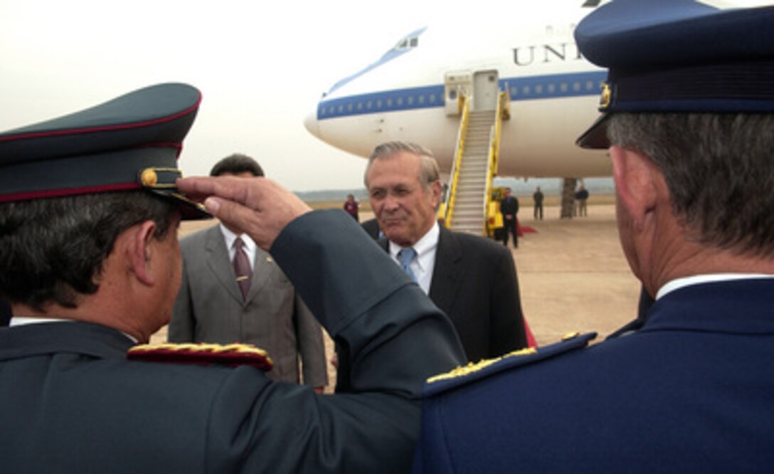 Secretary of Defense Donald H. Rumsfeld is introduced to Paraguayan generals as during arrival ceremonies at Silvio Pettirossi International Airport in Asuncion, Paraguay, on Aug. 16, 2005. Rumsfeld is in Paraguay to meet with his counterpart Minister of National Defense Roberto Gonzalez and Paraguayan President Nicanor Duarte-Frutos to discuss bilateral military cooperation in the region. 