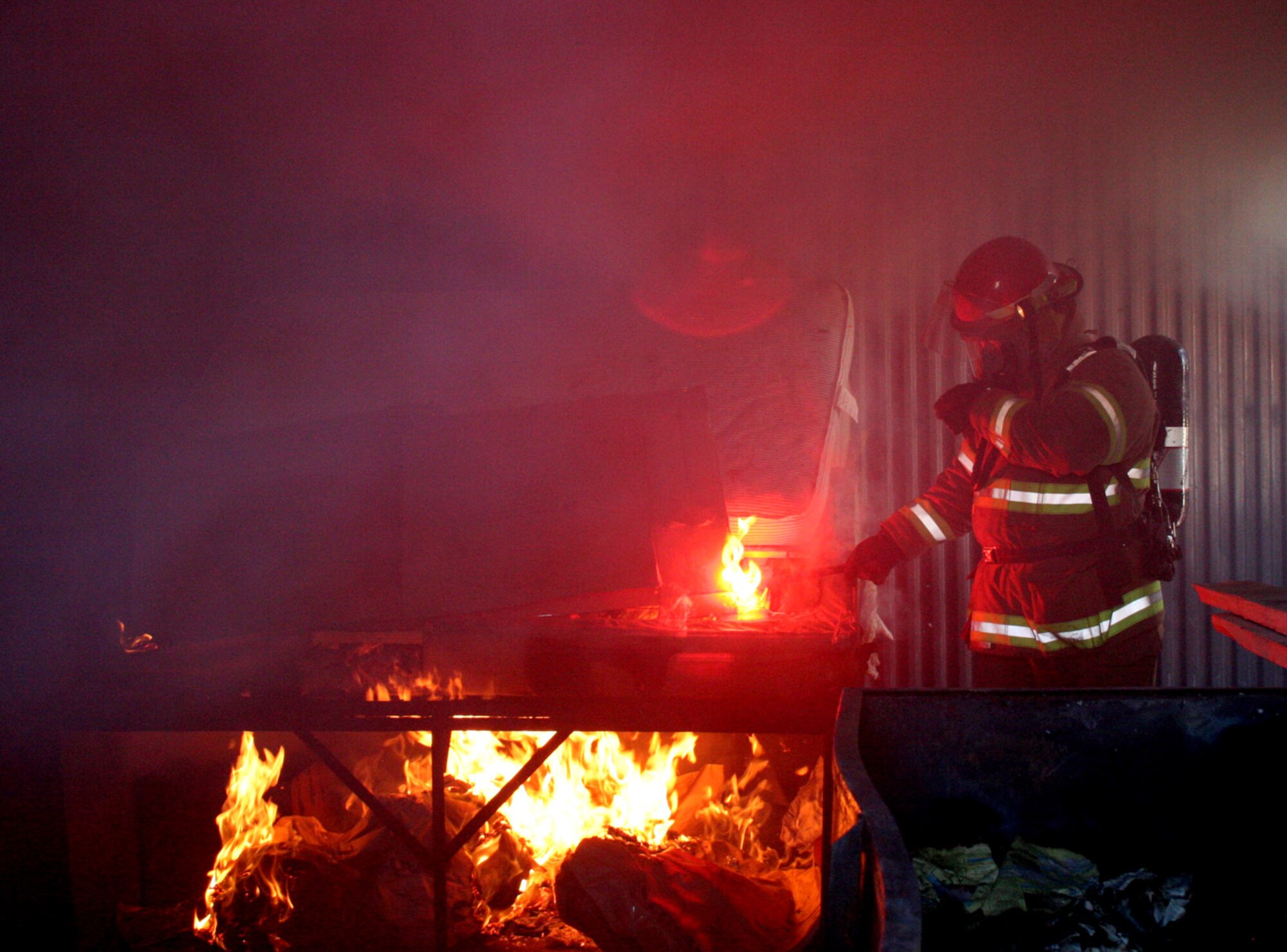 MOUNTAIN HOME AIR FORCE BASE, Idaho -- Fred Ellis starts the fire for a "live fire" training exercise here.  Firefighters with the 366th Civil Engineer Squadron's fire protection flight have trained more than 8,000 hours this year.  (U.S. Air Force photo)



