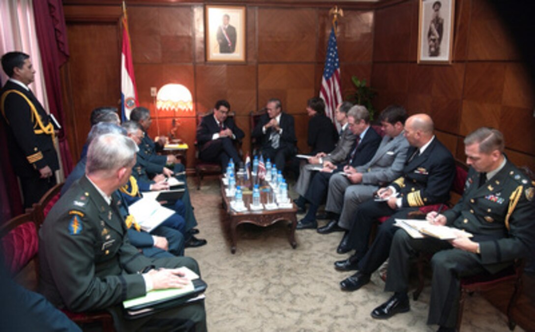 Secretary of Defense Donald H. Rumsfeld (center right) meets with Paraguay's Minister of National Defense Roberto Gonzalez (center left) in the Paraguay Ministry of Defense headquarters in Asuncion, Paraguay, on Aug. 17, 2005. Rumsfeld is in Paraguay to meet with Gonzalez and Paraguayan President Nicanor Duarte-Frutos to discuss bilateral military cooperation in the region. 