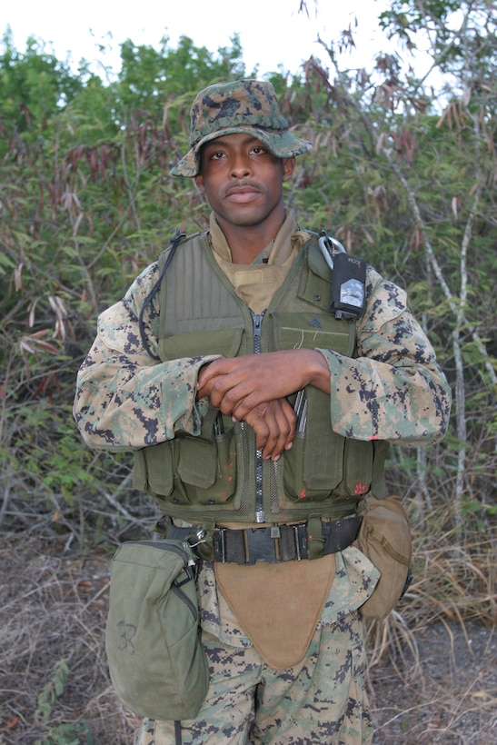 Cpl. Dwayne Adams, squadleader, 2nd squad, 2nd platoon, Alpha Company, 1st Battalion, 3rd Marine Regiment, stands at the Marine Corps Training Area Bellows, after taking part in raid training in which simunitions rounds were used to make the training seem more realistic. The training at Bellows was a workup for the unit's upcoming deployment to Afghanistan.