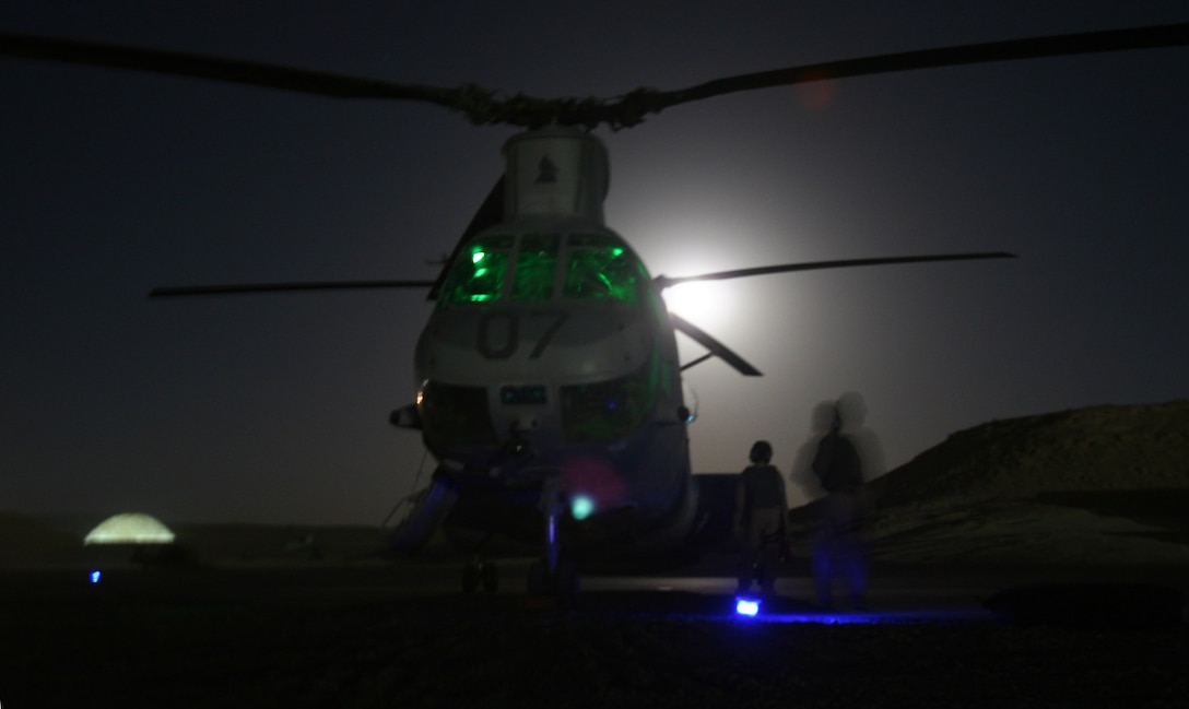 AL ASAD, Iraq ? A Fighting Griffin CH-46E crew goes through their start-up procedures before take-off here Aug. 19. The Fighting Griffins officially take over the mission from Marine Medium Helicopter Squadron 264, Aug. 20.