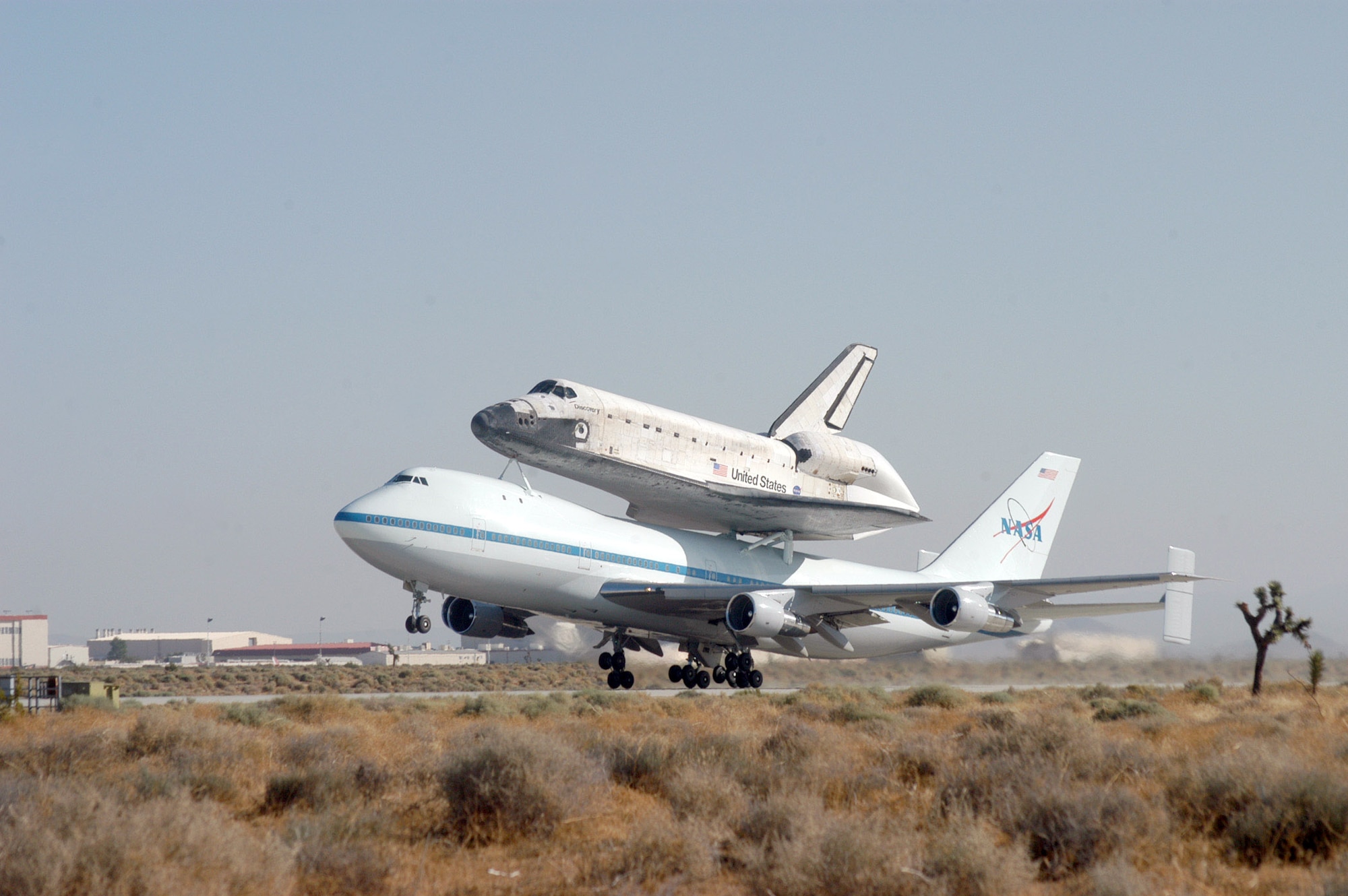 EDWARDS AIR FORCE BASE, Calif. -- Space Shuttle Discovery leaves Edwards on the back of a modified Boeing 747. The Aug. 19 takeoff marked the first leg of the orbiter's cross-country trek to its home at Kennedy Space Center in Florida. (U.S. Air Force photo by Senior Airman Jet Fabara)
