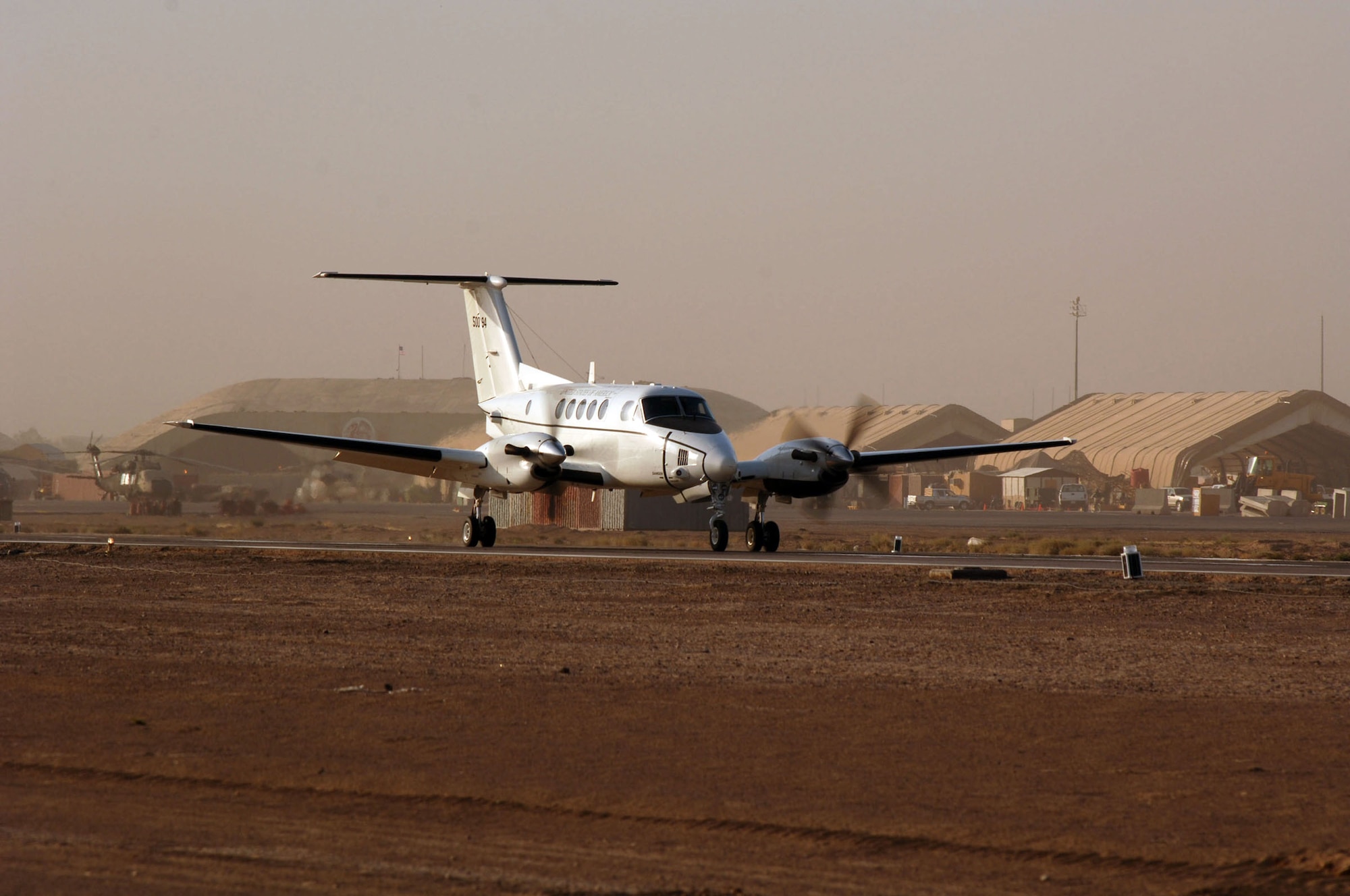 BALAD AIR BASE, Iraq -- An Army C-12 lands on the new runway here. The second runway opened Aug. 15 because Balad’s main runway began to deteriorate from constant use. (U.S. Air Force photo by Staff Sgt. Chad Chisholm)