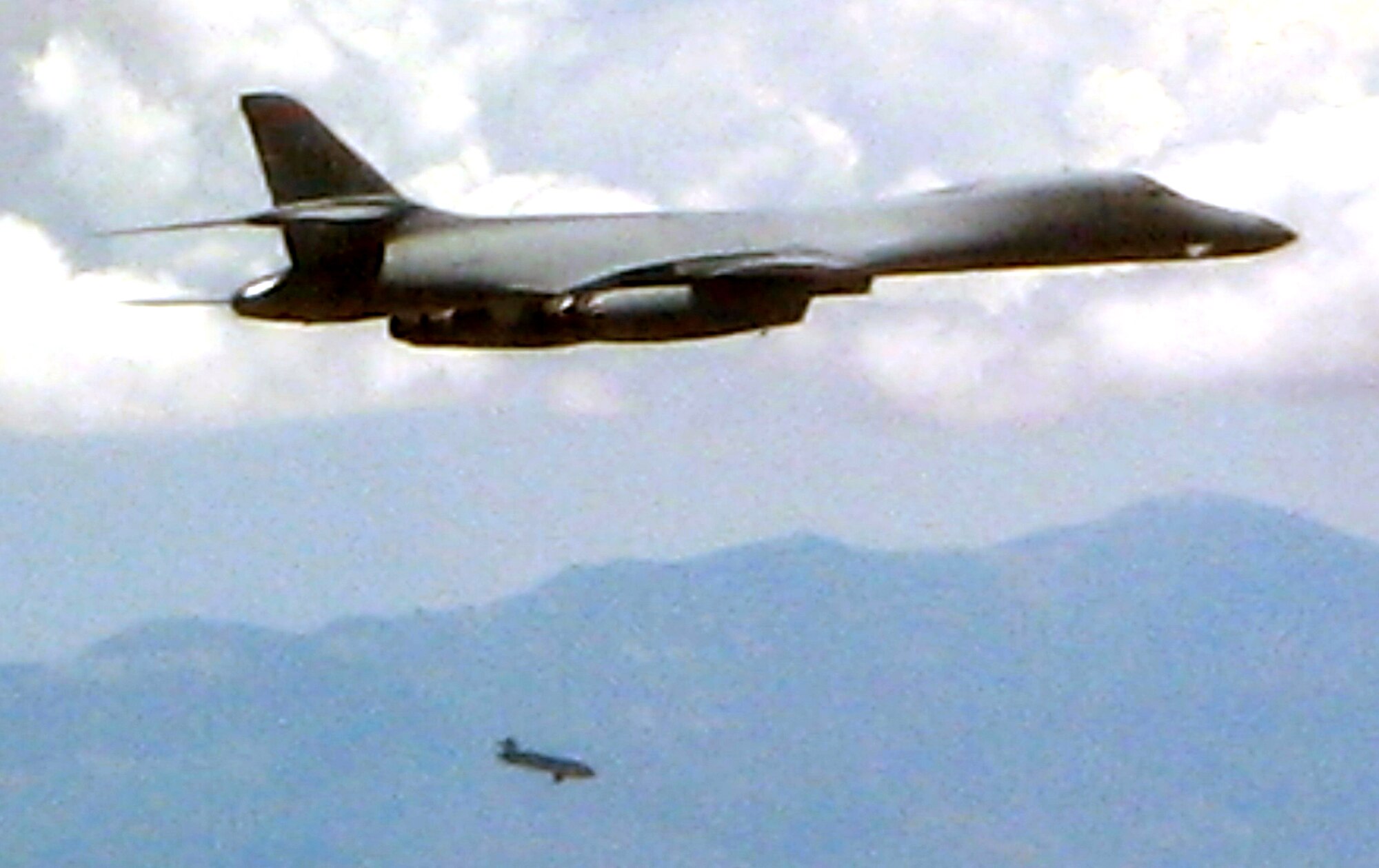 DYESS AIR FORCE BASE, Texas -- A B-1B from the 337th Test and Evaluation Squadron here releases a Joint Air-to-Surface Standoff Missile over the White Sands Missile Range, N.M. The 7th Bomb Wing here became the first unit to achieve initial operational capability of the JASSM cruise missile Aug. 18, which means the missile is able to be used in combat operations. (U.S. Air Force photo)
