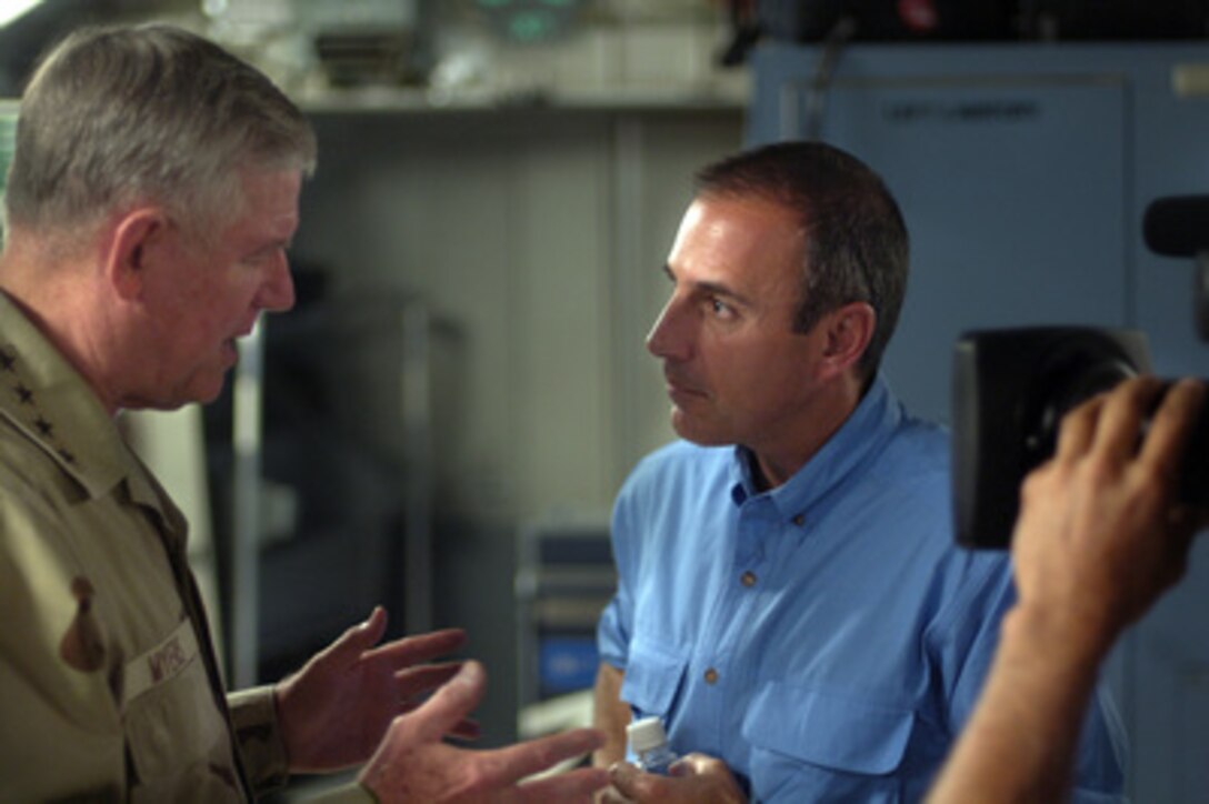 Today Show host Matt Lauer interviews Chairman of the Joint Chiefs of Staff Gen. Richard B. Myers, U.S. Air Force, while they fly in a C-17 Globemaster III over Iraq on Aug. 17, 2005. Myers is in the midst of a 10-day trip around the world to meet with servicemembers and assess troop morale. Fox Sports television personality and cover girl Leeann Tweeden, NFL Hall of Fame member Gale Sayers, and comedians Jeffrey Ross and Colin Quinn are accompanying Myers as he thanks the service men and women for their sacrifices. 