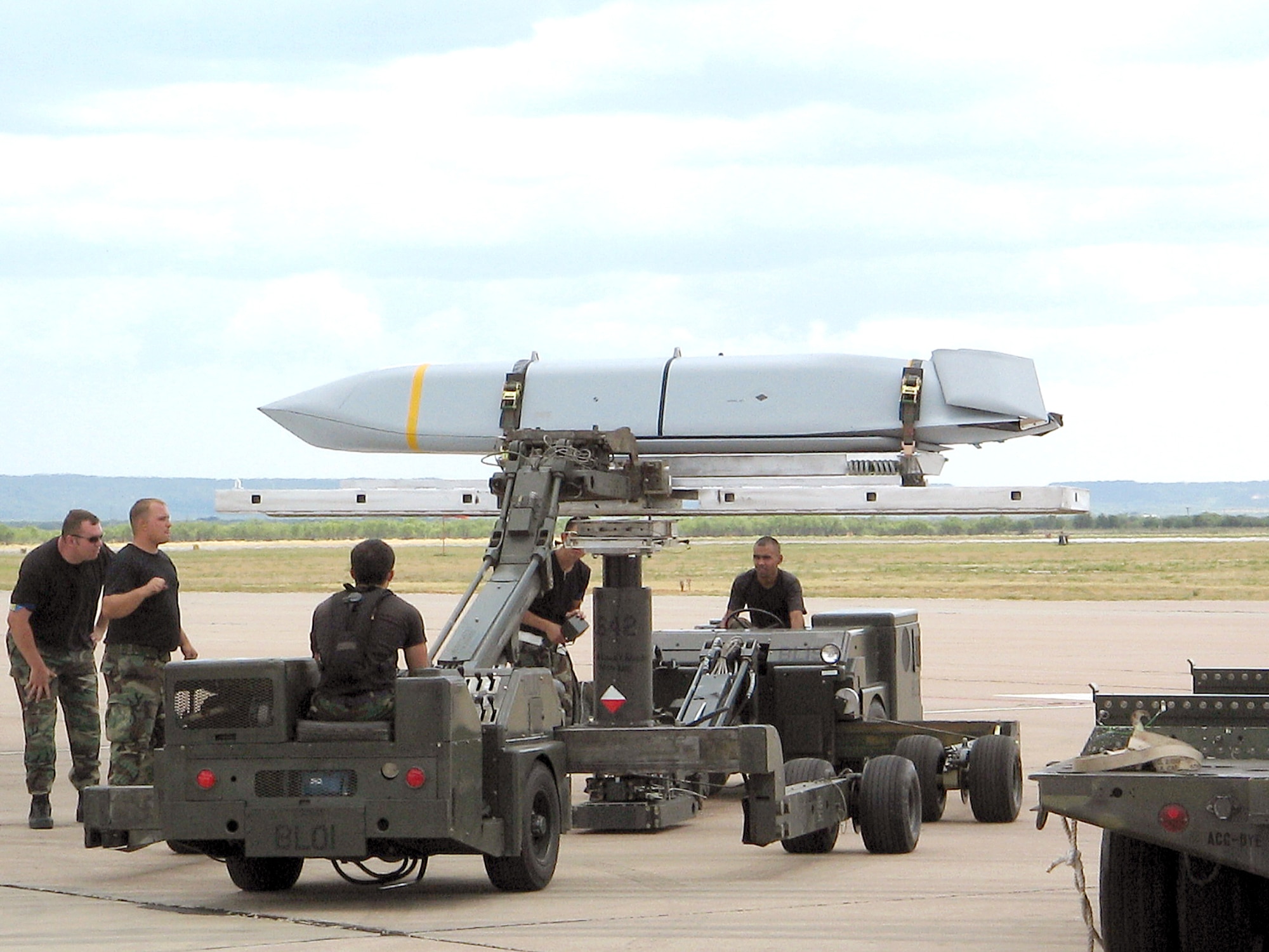 DYESS AIR FORCE BASE, Texas -- Airmen here prepare a Joint Air-to-Surface Standoff Missile to be loaded onto a B-1B Lancer. The 7th Bomb Wing here became the first unit to achieve initial operational capability of the JASSM cruise missile Aug. 18, which means the missile is able to be used in combat operations. The JASSM, or AGM-158A, is an air-to-surface, single warhead self-propelled missile. (U.S. Air Force photo)