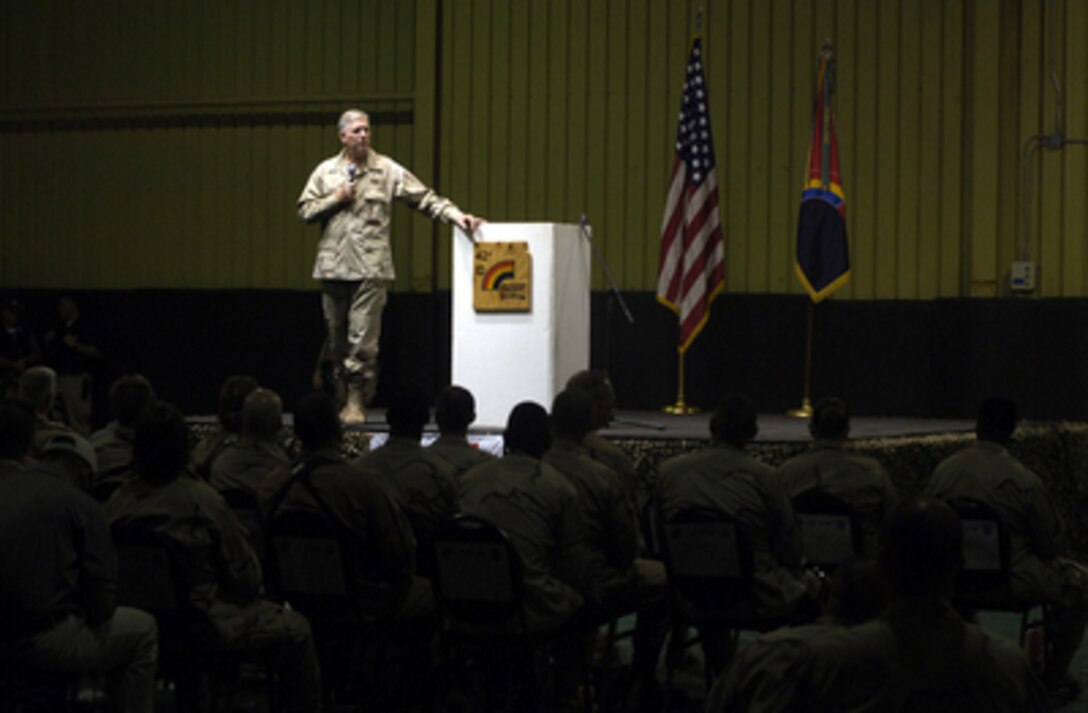 Chairman of the Joint Chiefs of Staff Gen. Richard B. Myers, U.S. Air Force, addresses an audience during a United Service Organizations show at Camp Speicher, Iraq, on Aug. 17, 2005. Myers is in the midst of a 10-day trip around the world to meet with servicemembers and assess troop morale. Fox Sports television personality and cover girl Leeann Tweeden, NFL Hall of Fame member Gale Sayers, and comedians Jeffrey Ross and Colin Quinn are accompanying Myers as he thanks the service men and women for their sacrifices. 