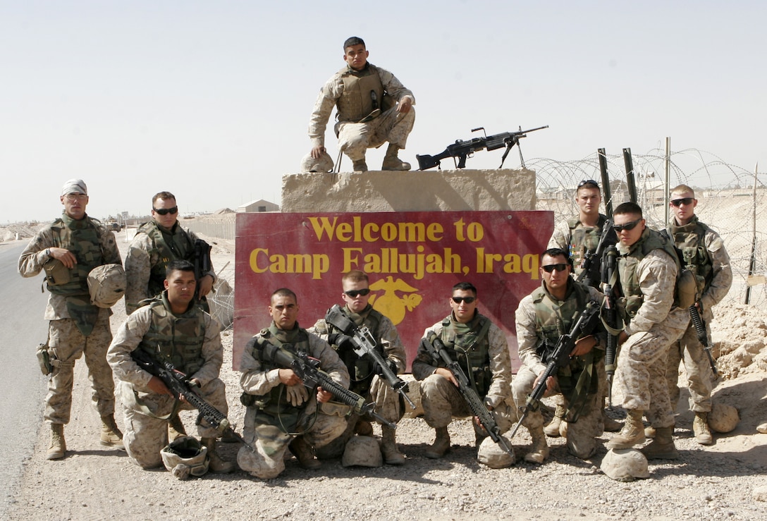 CAMP FALLUJAH, Iraq - The Marines of 3rd Squad, 4th Platoon, Quick Reaction Force, Force Protection Company, II Marine Expeditionary Force (FWD), pose after conducting a security operation recently. They currently assist in patrolling areas surrounding Camp Fallujah. (Official U.S. Marine Corps photo by Cpl. Ruben D. Maestre)