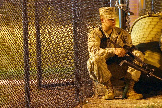Lance Cpl. Edward Brown Lance Cpl. Mathew Whitford, a motor transport mechanic with Marine Wing Support Squadron, sits outside the Air Station armory awaiting order to get on the bus that will take the Sweathogs to Marine Corps Air Station Cherry Point, N.C, Aug. 22. The Sweathogs were then flown to Al Asad, Iraq from MCAS Cherry Point.