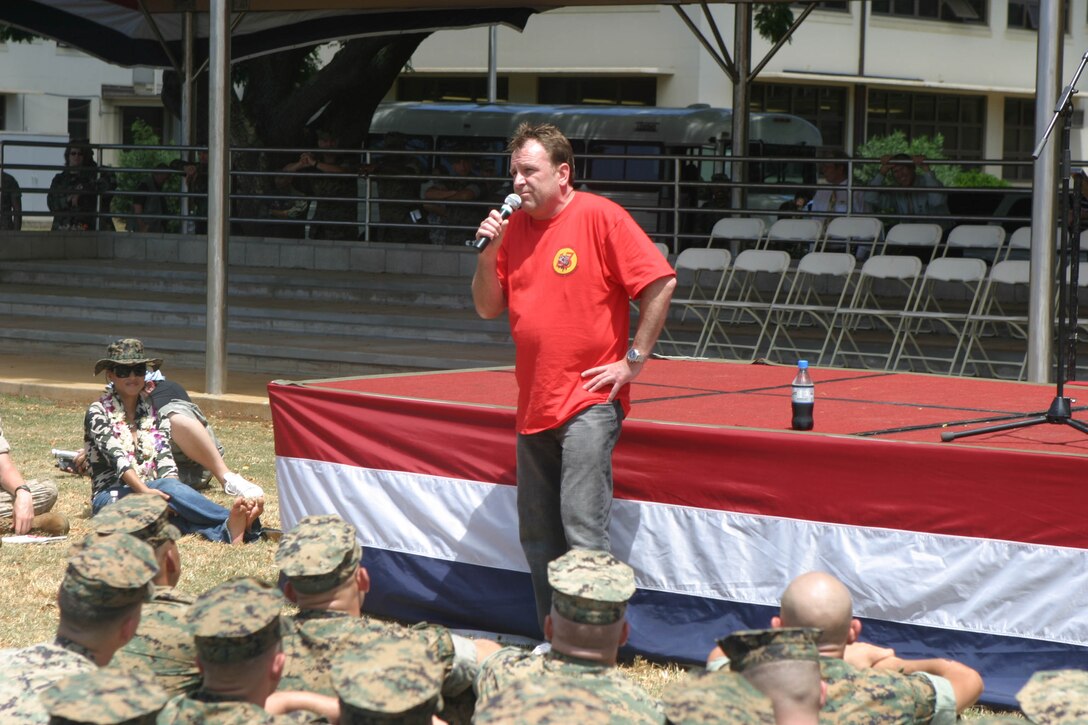 Comedian, Colin Quinn, performs for Marines and Sailors at Marine Corps Base Hawaii, Kaneohe Bay, Aug. 22. Quinn has been on many of the USO tours and says this has been the best yet.  Other visitors of the tour consisted of comedian Jeffrey Ross, NFL star Gale Sayers and model Leeann Tweeden.