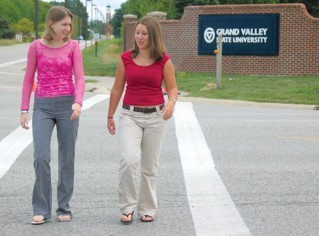 Sarah Jennings, left, walks away from Grand Valley State University with a friend Aug. 23. Jennings turned down a music scholarship to the university and joined the Marine Corps? Delayed Entry Program in Muskegon, Mich.