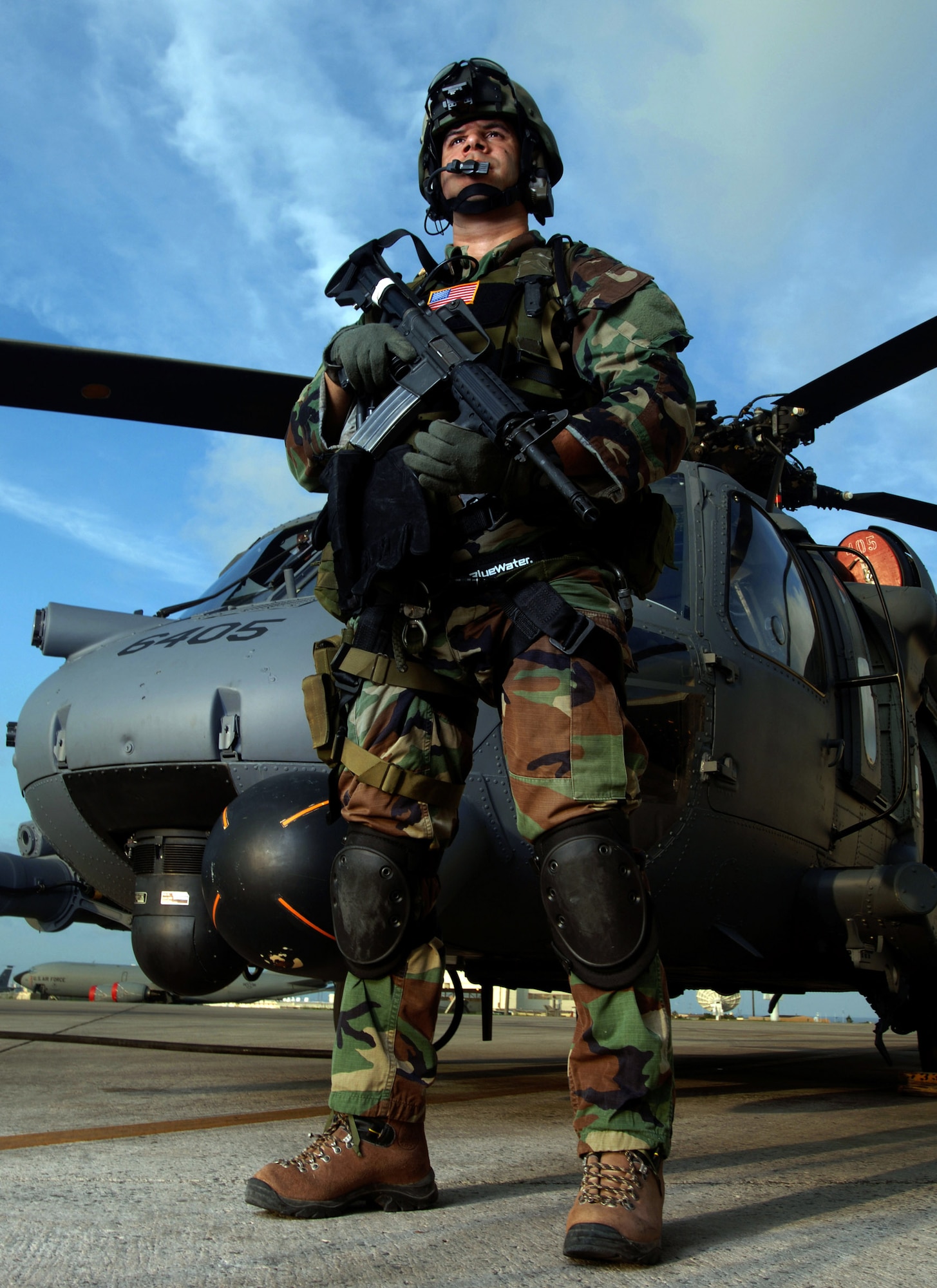 KADENA AIR BASE, Japan -- Staff Sgt. J. Pierre Griffin observes flightline activities during training here. The 31st Rescue Squadron trains, equips and employs combat-ready pararescuemen worldwide. They also use any means available to provide combat and humanitarian search and rescue and medical assistance in all environments.  Sergeant Griffin is a pararescueman from the 31st RQS here. (U.S. Air Force photo by Master Sgt. Val Gempis)