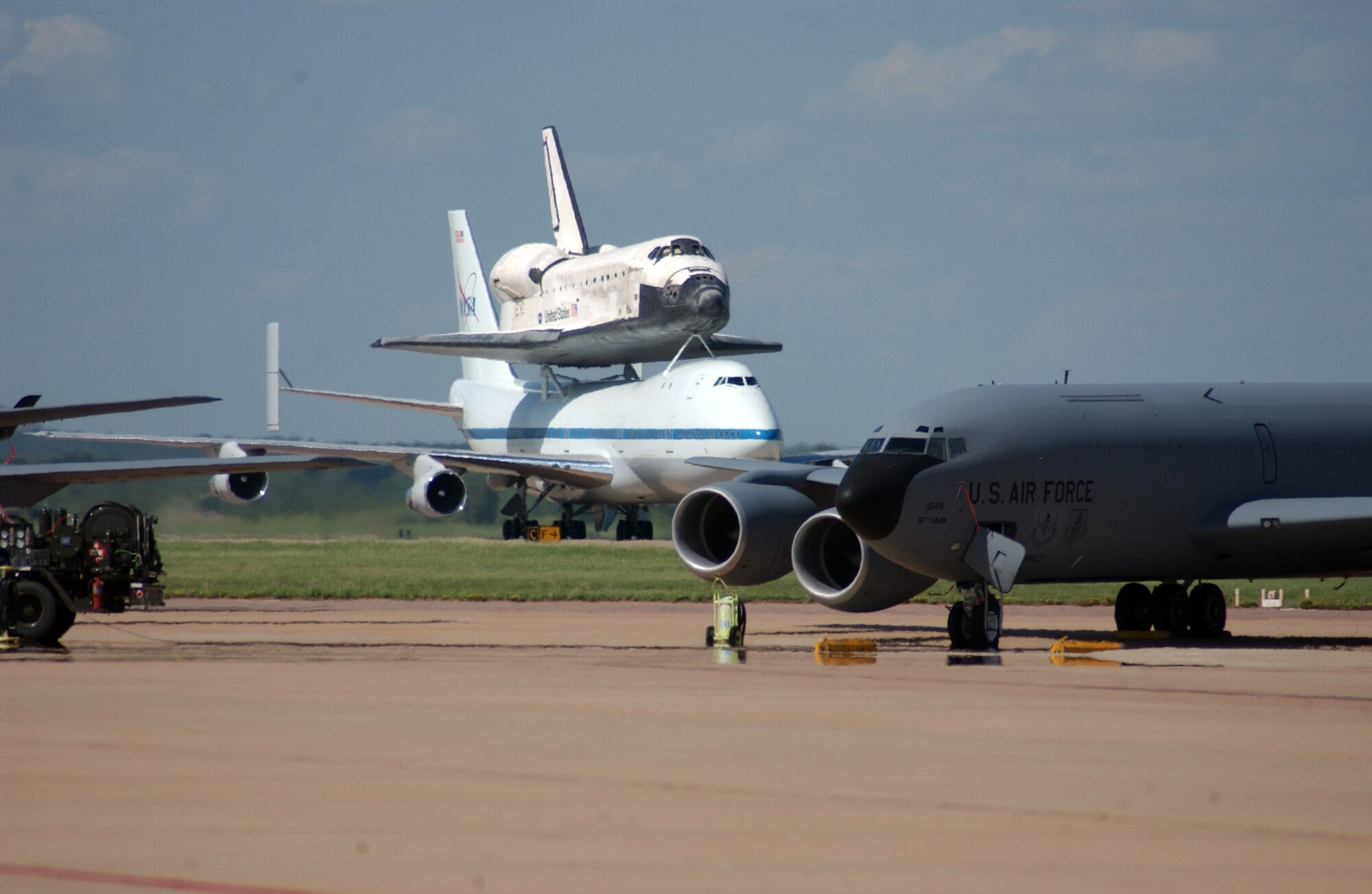 ALTUS AIR FORCE BASE, Okla. --  A NASA Boeing 747 carrying Space Shuttle Discovery, still scorched from its re-entry into Earth's atmosphere, taxis for takeoff here on Aug. 19.  Discovery's stop was the first of two as the shuttle was on its way back to Kennedy Space Center, Fla., after landing at Edwards Air Force Base, Calif., Aug. 9.   (U.S. Air Force photo by Staff Sgt. Monique Randolph) 