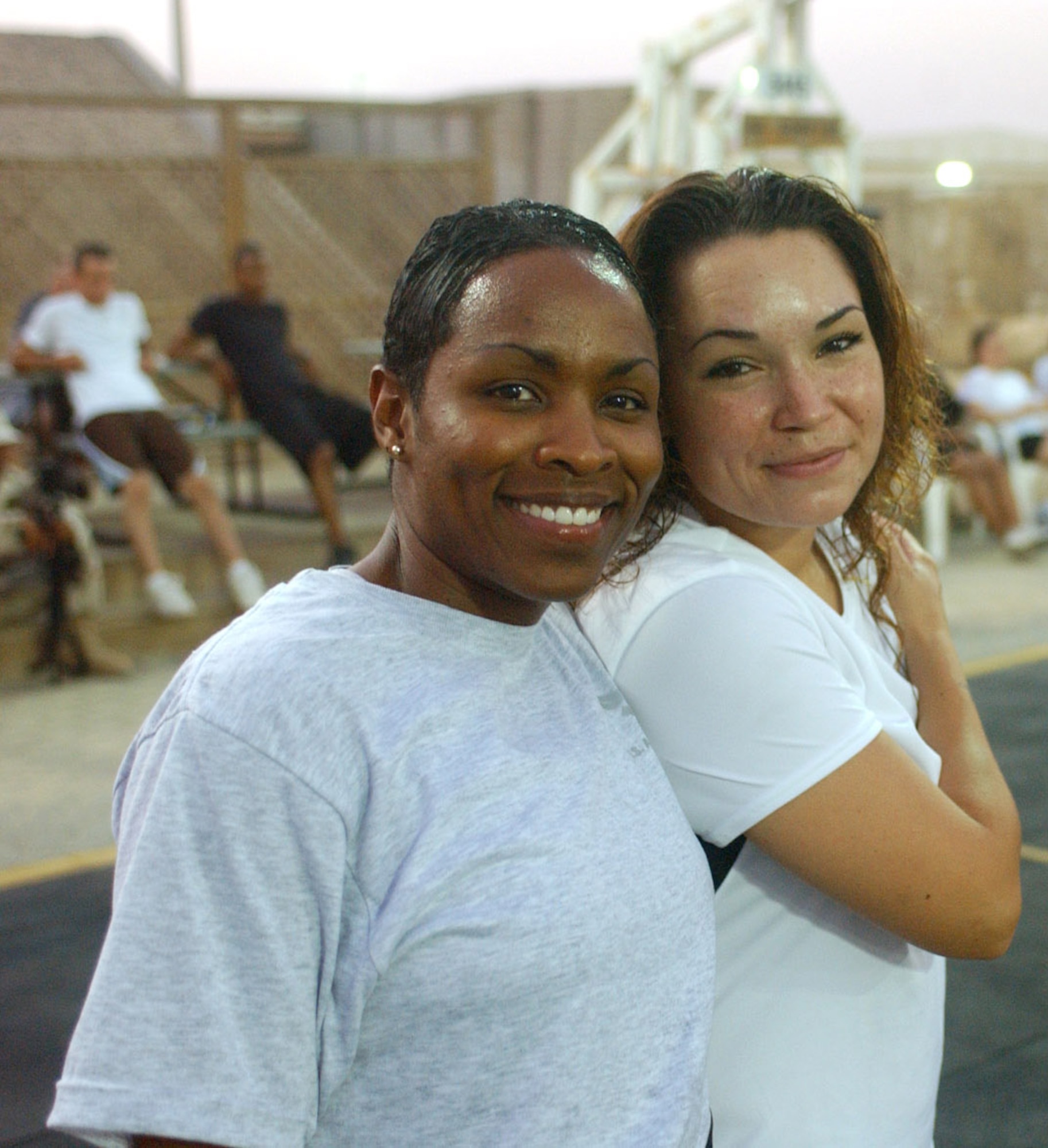 SOUTHWEST ASIA -- Tech. Sgt. Kimberly Latimer (left) and Senior Airman Elisha Olivas were two of the top female competitors at a recent powerlifting competition here.  Airman Olivas is also a professional boxer with a 4-4-1 record.  (U.S. Air Force photo by Master Sgt. Dale Canofari)