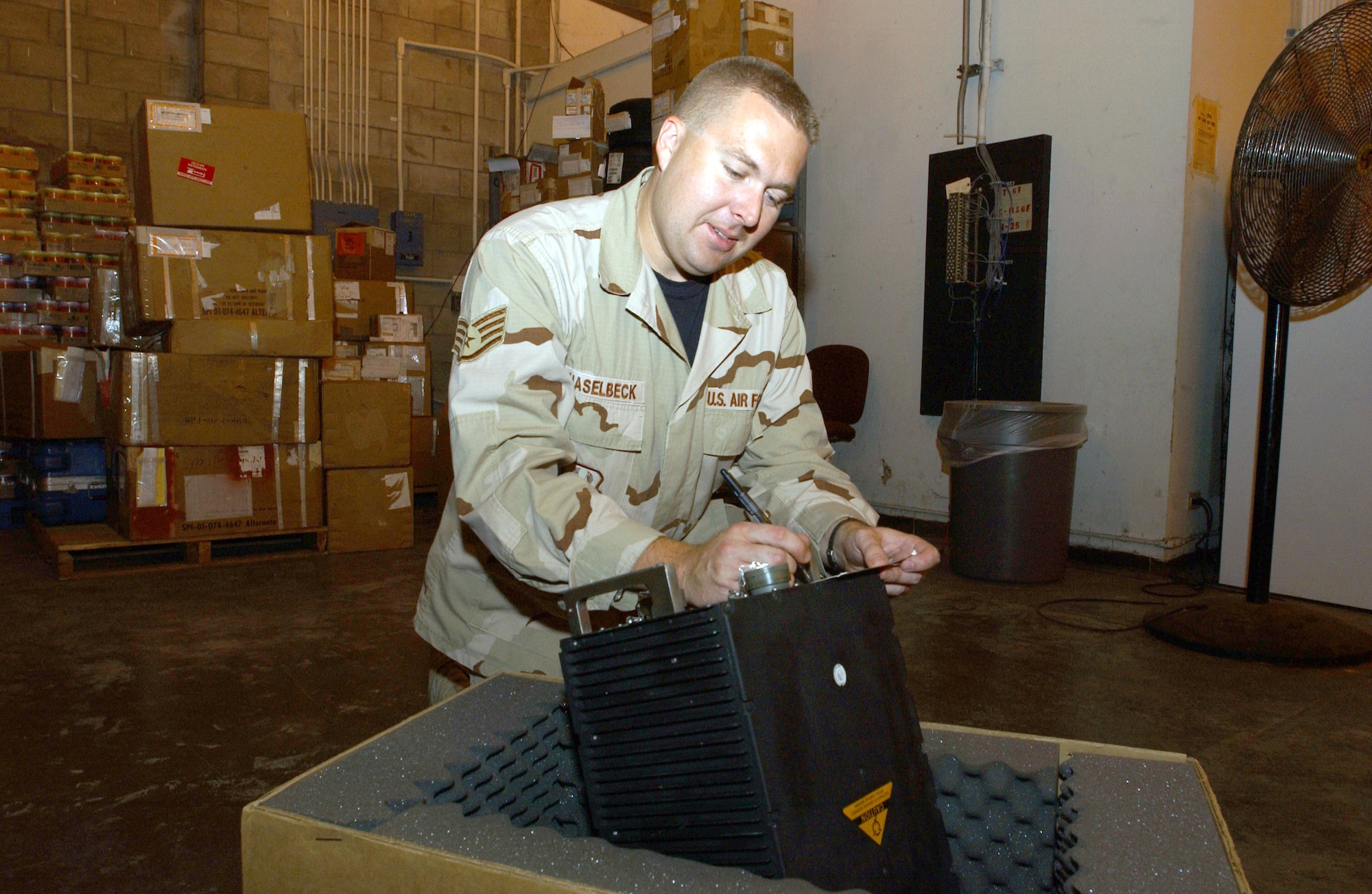 OPERATION ENDURING FREEDOM -- Staff Sgt. Kurt Haselbeck inventories aircraft parts received at the supply warehouse at this forward-deployed location.  He is assigned to the 40th Expeditionary Logistics Readiness Flight and is deployed from Minot Air Force Base, N.D.  (U.S. Air Force photo by Staff Sgt. Jocelyn Rich)                 