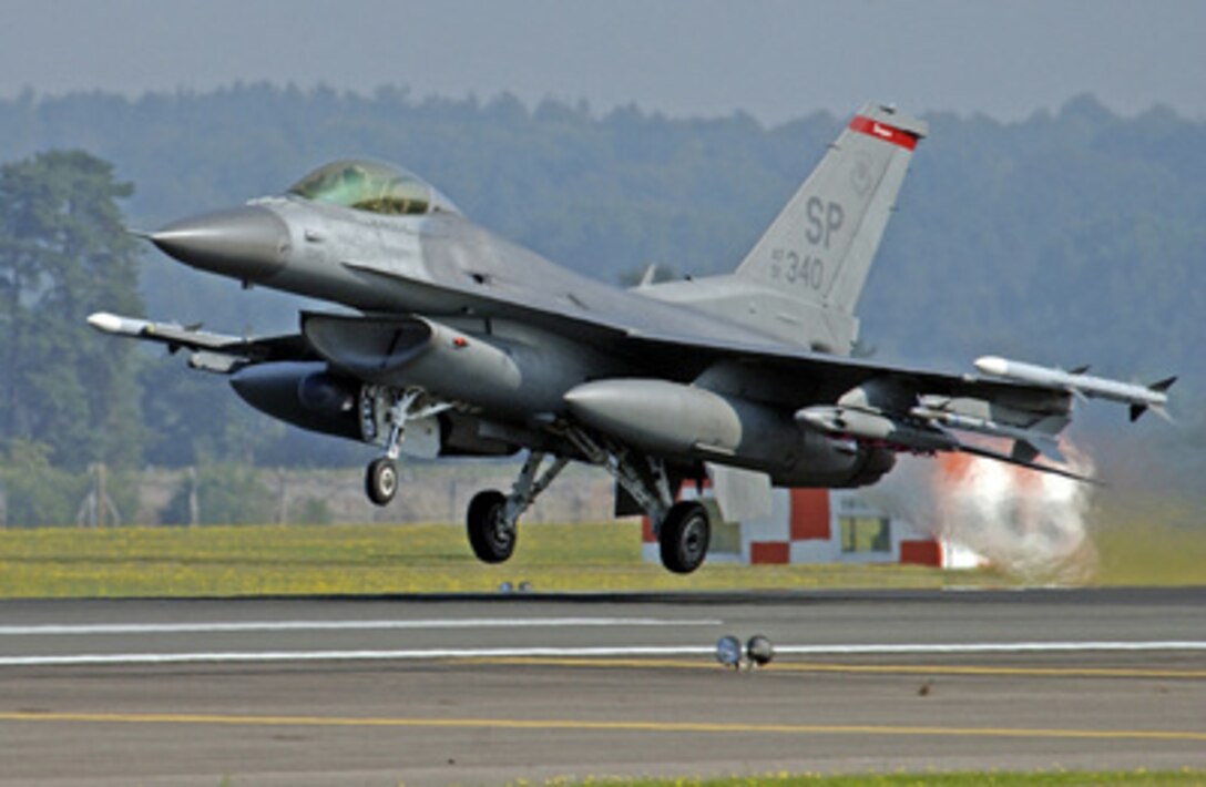 An Air Force F-16C Fighting Falcon takes off from Royal Air Force Lakenheath and heads towards the bombing range at Royal Air Force Holbeach, United Kingdom, on Aug. 18, 2005. The Fighting Falcon, from the 22nd Fighter Squadron, Spangdahlem Air Base, Germany, is participating the Excalibur bombing competition. 