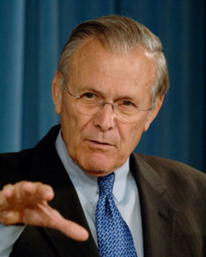 Secretary of Defense Donald H. Rumsfeld responds to a reporter's question during a press briefing with Vice Chairman of the Joint Chiefs of Staff Adm. Edmund Giambastiani, U.S. Navy, in the Pentagon on Aug. 23, 2005. 