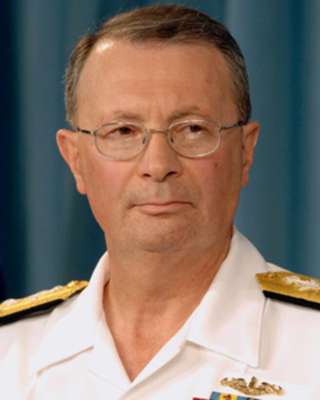 Vice Chairman of the Joint Chiefs of Staff Adm. Edmund Giambastiani, U.S. Navy, listens to a reporter's question during a press briefing with Secretary of Defense Donald H. Rumsfeld in the Pentagon on Aug. 23, 2005. 