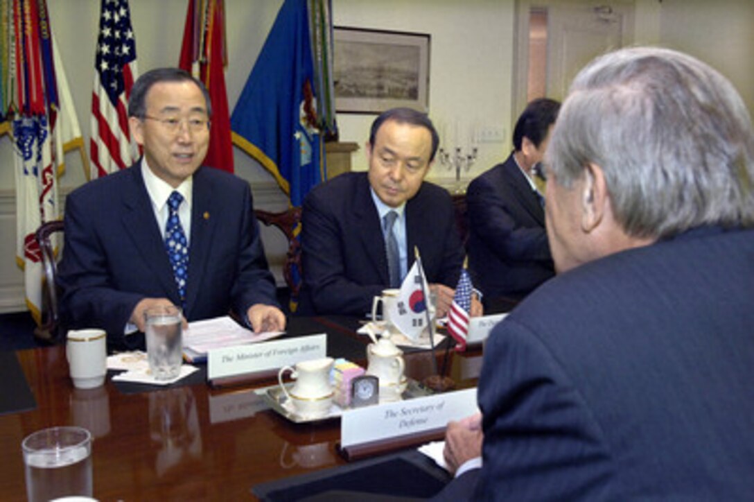 South Korean Minister of Foreign Affairs Ban Ki-moon (left) meets with Secretary of Defense Donald H. Rumsfeld (foreground) in the Pentagon for bilateral security discussions on Aug. 23, 2005. Among those participating in the talks is Deputy Minister of Foreign Affairs Song Min-soon (center). 