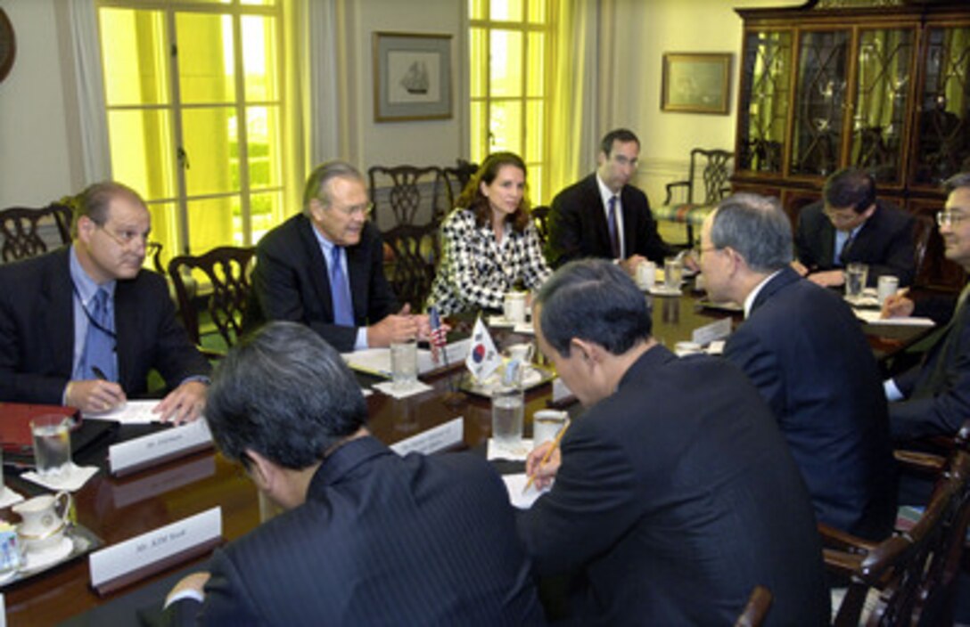 Secretary of Defense Donald H. Rumsfeld (2nd from left) hosts a Pentagon meeting to discuss bilateral security issues with South Korean Minister of Foreign Affairs Ban Ki-moon (center right) in the Pentagon on Aug. 23, 2005. Joining Rumsfeld on the U.S. side of the table are Under Secretary of Defense for Policy Eric Edelman (left), Principal Deputy Assistant Secretary of Defense for International Security Affairs Mary Beth Long (2nd from right) and Bob Scher (right) of the Pentagon's Asia-Pacific Office. On the Korean side are Director General for North American Affairs Kim Sook (left), Deputy Minister of Foreign Affairs Song Min-soon (2nd from left), Ambassador Hong Seok Hyun (right) and, (at the end of the table) Kim Hyoung-zhin, director, North American Division. 