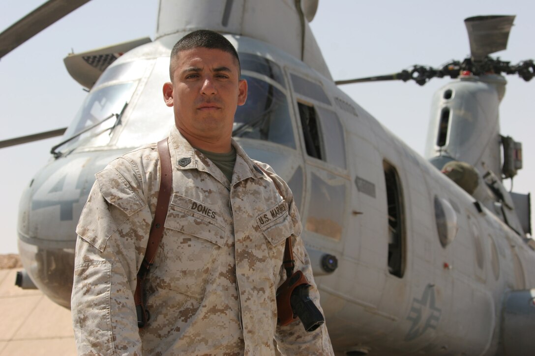 AL ASAD, Iraq ? Gunnery Sgt. Francisco Dones, the embarkation and logistics chief with Marine Medium Helicopter Squadron 764 and Lancaster, Calif., native poses in front of a Moonlight CH-46. Dones joined the Marine Corps in 1986 to become a motor transportation vehicle operator after graduating from Van Nuys High School.