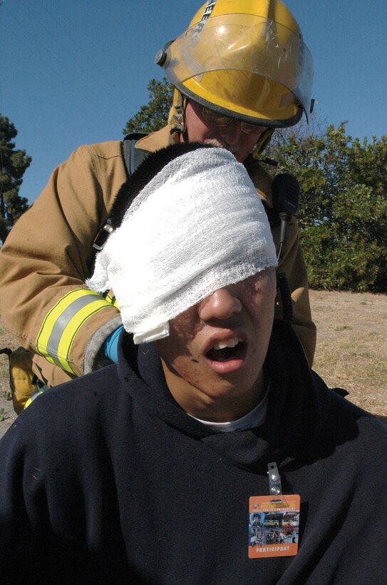 Seaman Apprentice Linh N. Dang, 19, from Milpitas, Calif., volunteered to be a victim during Vector West Aug. 25. Vector West is an annual training exercise that allows the base's Incident Response Team and Crisis Action Team the opportunity to practice their force protection and counterterrorism capabilities.