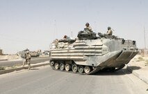 Lance Cpl. Candessa A. Benn, a Marine with the Chemical Biological Incident Response Force, cradles a baby in her arms during the collapsed structure trainer evolution at the Raymond M. Downey Sr. Training Facility located in Indian Head, Md., August 25.  The trainer conditions students to overcome a myriad of challenges while executing the mission of extracting casualties from a confined space environment.  In addition to the small spaces the students must navigate themselves through, they must also properly triage and package casualties for navigation through the same areas.