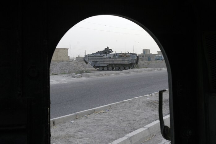 Corporal Leon M. Howard, a Nancy, Ky., native pulls a casualty through the collapsed structure trainer at the Raymond M. Downey Sr. Training Facility located in Indian Head, Md., August 25.  The Marine, who serves with the Chemical Biological Incident Response Force, must overcome several challenges while negotiating the confined space within the trainer.  In addition to operating in small spaces, the students who go through the trainer must properly package the casualties they are extracting in low-light conditions.