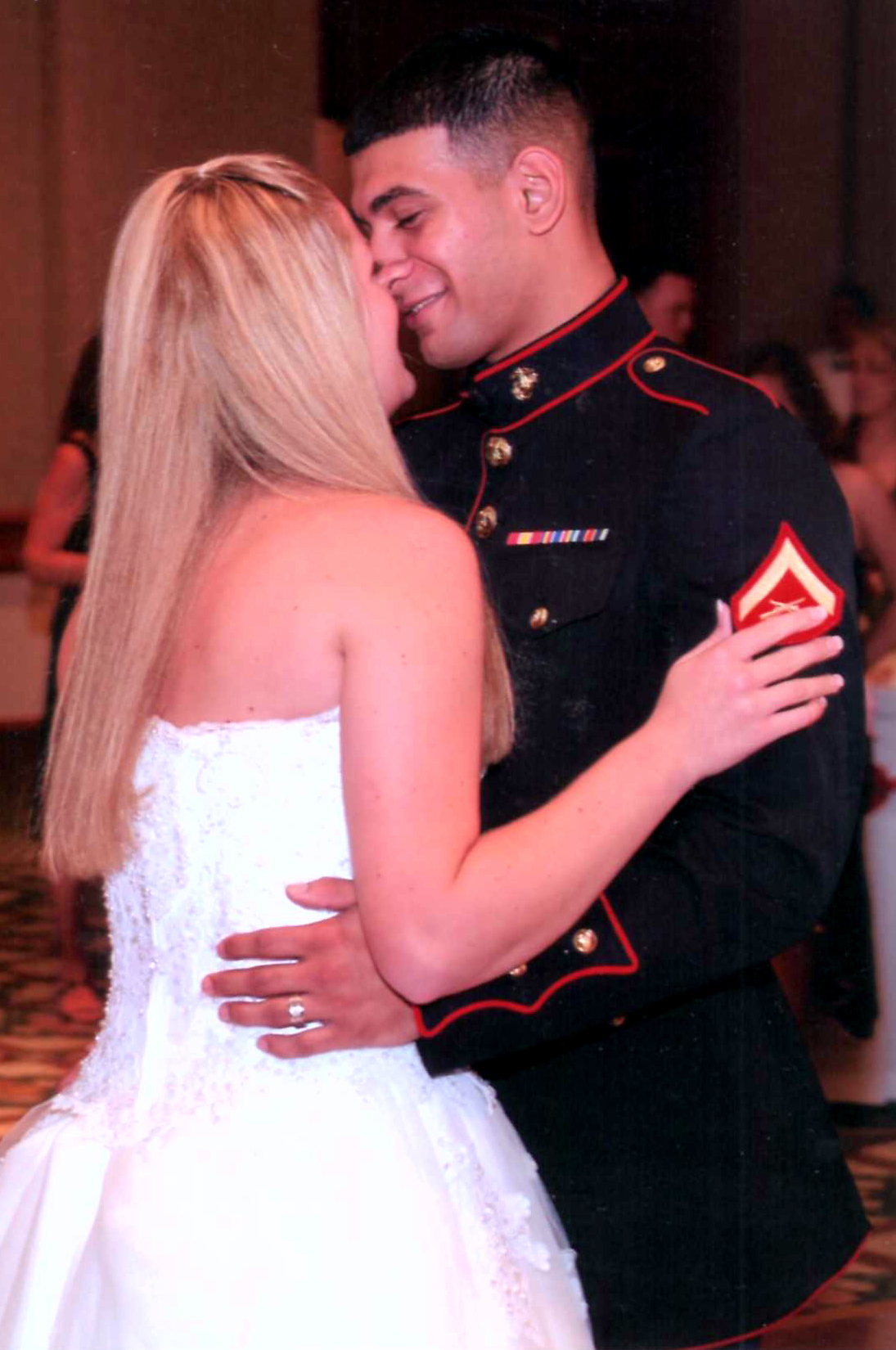 Lance Cpl. Kara Perez and Lance Cpl. Victor Perez dance for the first time as a married couple during their wedding, Aug. 27, 2005.