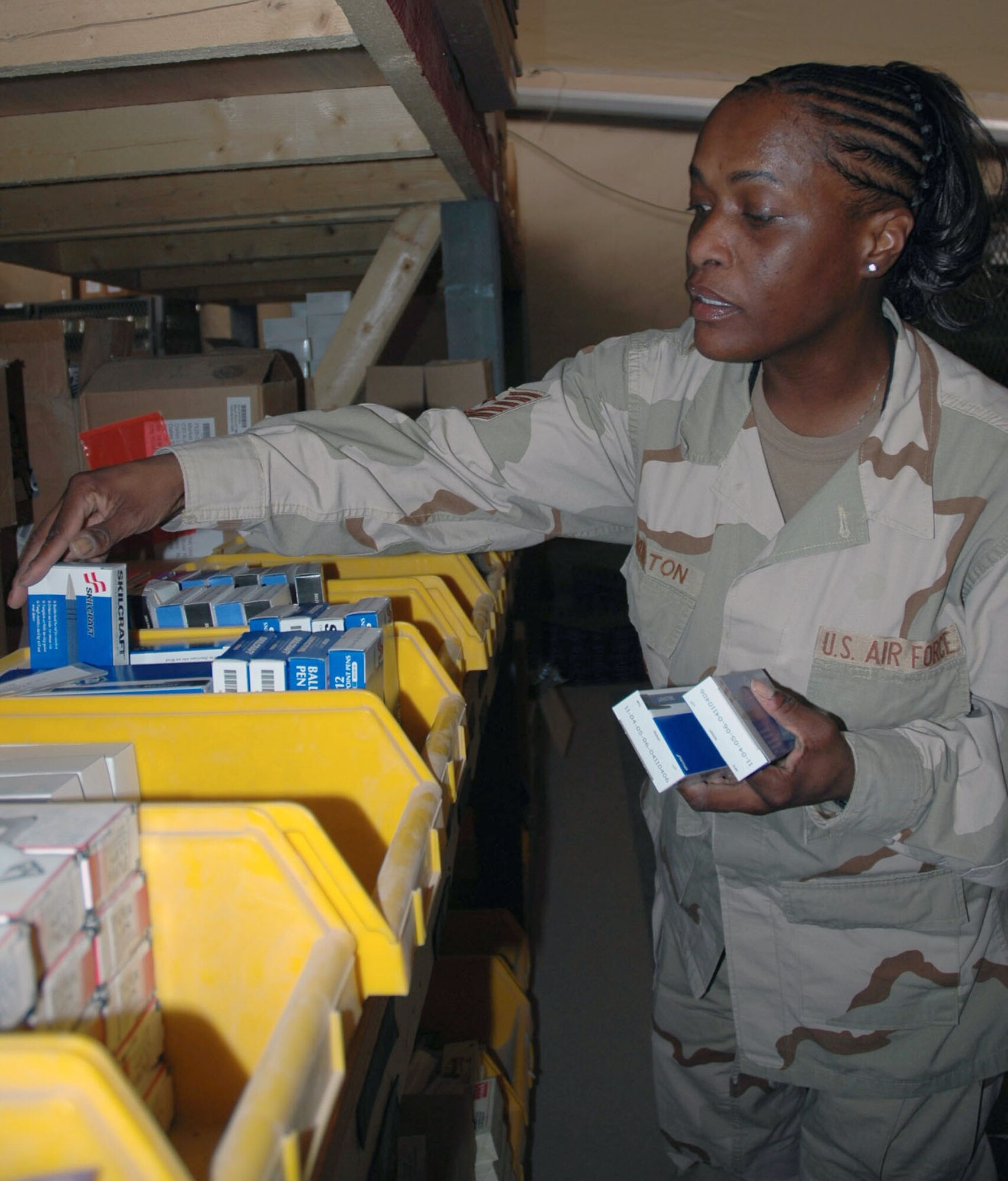 BAGHDAD, Iraq -- Tech. Sgt. Tonya Hamilton keeps Airmen assigned to the 447th Air Expeditionary Wing fully stocked with essential office supplies and individual equipment items such as hats, gloves and uniform items.  Sergeant Hamilton is the noncommissioned officer in charge of the base service supply store here and is deployed from Luke Air Force Base, Ariz.  (U.S. Air Force photo by Senior Airman Chawntain Sloan)