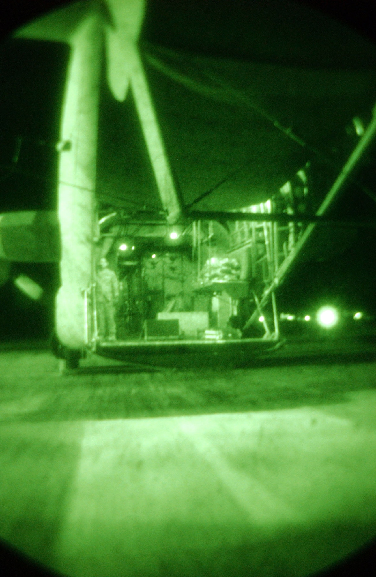 BAGRAM AIR BASE, Afghanistan -- Staff Sgt. Brien Stanford opens the back ramp to an EC-130H Compass Call to allow life support to load mission essential equipment. Sergeant Stanford is a crew chief with the 41st Expeditionary Electronic Combat Squadron and is deployed from Davis-Monthan Air Force Base, Ariz. (U.S. Air Force photo by Airman 1st Class Desiree L. Hayden)