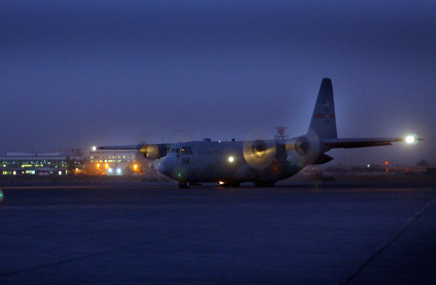 BAGHDAD, Iraq -- A C-130 Hercules deployed from Dyess Air Force Base, Texas, taxis for takeoff.  The aircraft was on the ground here less than an hour as it fueled up and swapped out passengers before continuing on its next mission supporting Operation Iraqi Freedom.  (U.S. Air Force photo by Tech. Sgt. Brian Davidson)                