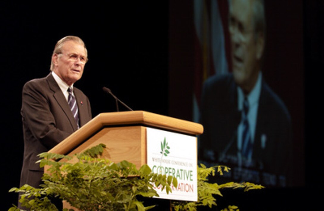 Secretary of Defense Donald H. Rumsfeld addresses the audience at the 4th Annual White House Conference on Cooperative Conservation at the St. Louis, Missouri Convention Center on Aug. 29, 2005. The three-day White House Conference on Cooperative Conservation is bringing together more than 1,200 leaders from federal, state, local and tribal government, industry, academia, nonprofit environmental organizations and private landowners. President Bush convened the conference to provide a forum for leaders to exchange information and to identify innovative and effective approaches to promoting cooperative conservation. 