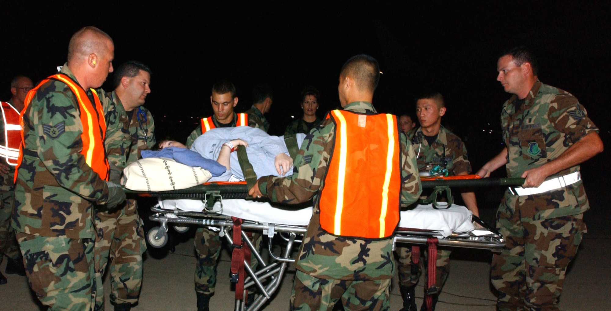 LACKLAND AIR FORCE BASE, Texas - A medical patient evacuated from Keesler Air Force Base, Miss., in the wake of Hurricane Katrina is unloaded from a C-17 Globemaster III here Aug. 30. Her medical care will be continued at Wilford Hall Medical Center. The aircrew is from the Mississippi Air National Guard. (U.S. Air Force photo by Senior Airman Heather M. Norris)