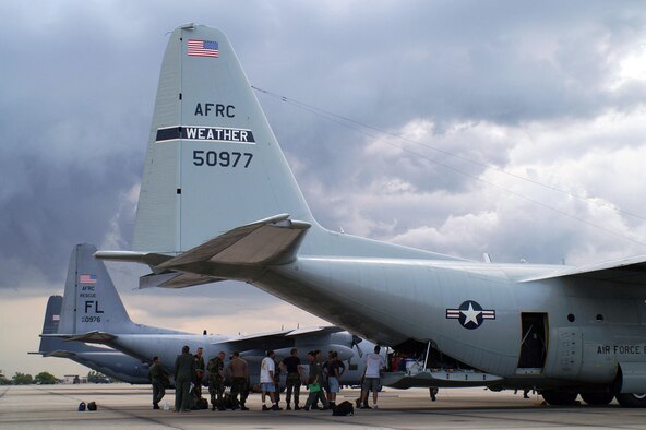 PATRICK AIR FORCE BASE, Fla. -- Rescue crews and support people from the 920th Rescue Wing load supplies and support material, including an all-terrain vehicle, onto an HC-130 P/N aircraft here Aug. 30.  A team of 50 unit reservists expect to be deployed for a week, living off of supplies they carry with them.  (U.S. Air Force photo by Capt. Wade Arnold)