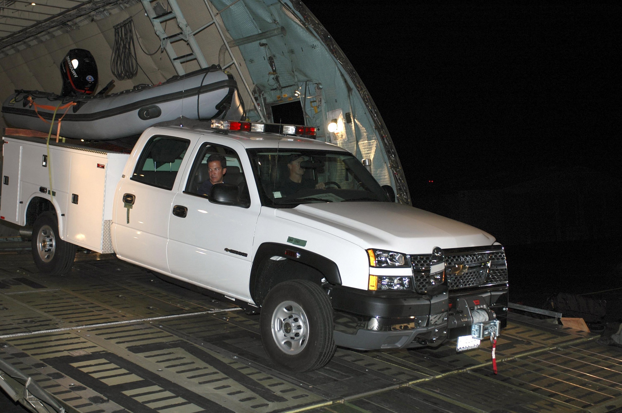 LAFAYETTE, La. -- Members of the California Governor's Office of Emergency Services Special Operation Urban Search and Rescue team unload emergency equipment here from a C-5 Galaxy from Travis Air Force Base, Calif., on Aug. 30.  The vehicle will be used for Hurricane Katrina relief operations in Mississippi and Louisiana.  (U.S. Air Force photo by Staff Sgt. Candy Knight)