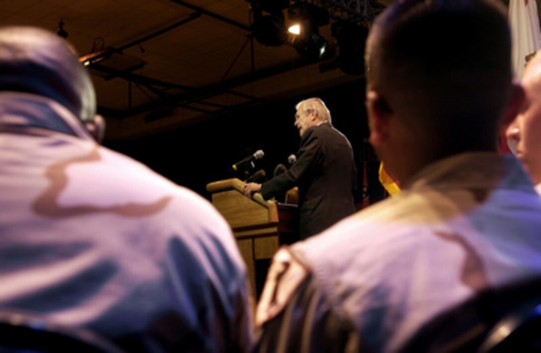 Secretary of Defense Donald H. Rumsfeld addresses an audience of soldiers and family members from the Army's 4th Infantry Division and 11th Cavalry Regiment at a town hall meeting at Fort Irwin, Calif., on Aug. 29, 2005. Rumsfeld took questions from the audience and then met with the families of several soldiers who died in combat. 