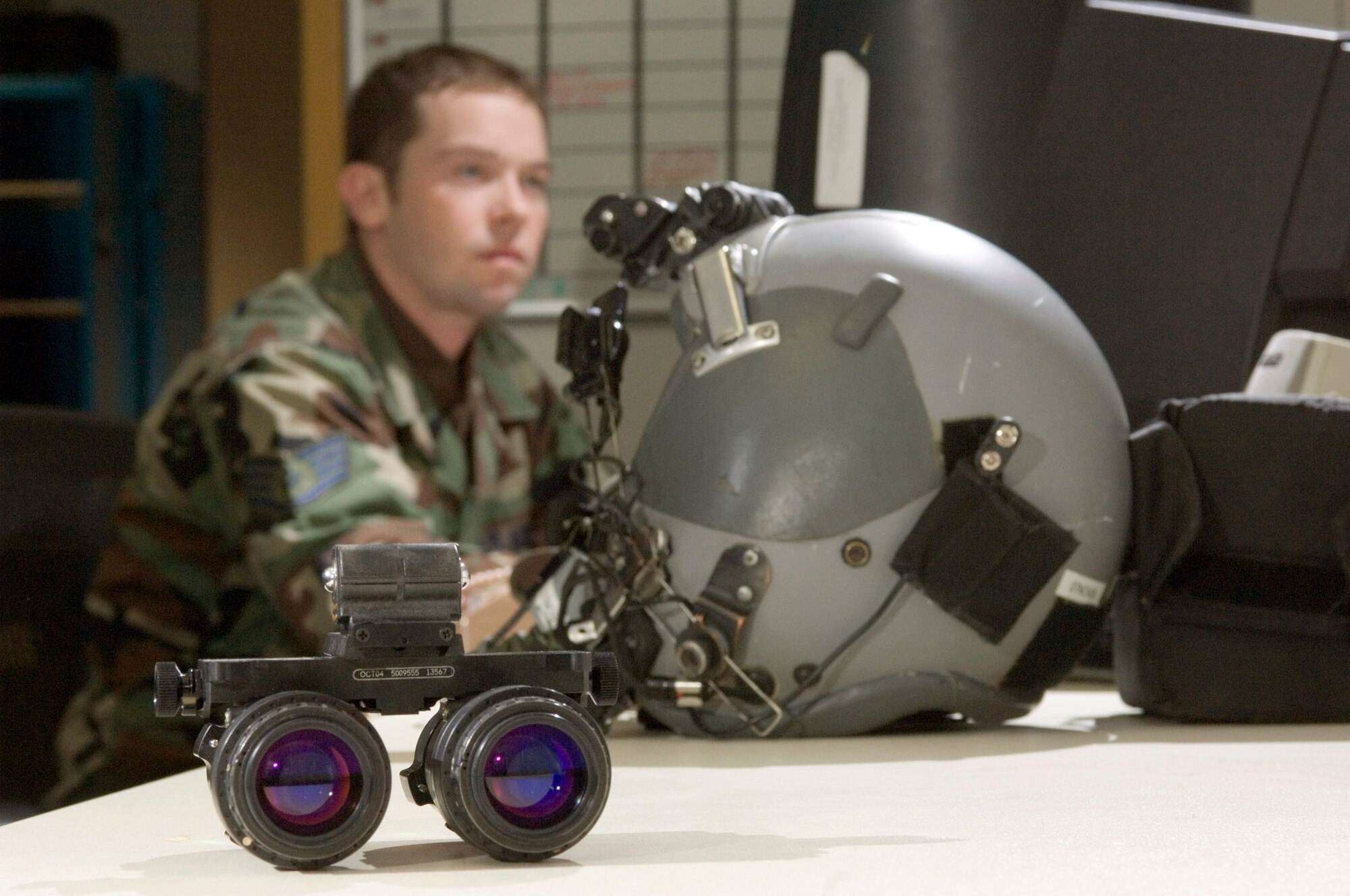 RAMSTEIN AIR BASE, Germany (AFPN) -- Staff Sgt. Joshua Page reviews the life support section's daily flight requirements. The section keeps all aircrew gear ready. Night vision goggles, parachutes and survival vests are just a few of the items they maintain. Sergeant Page is a life support journeyman with the 37th Airlift Squadron and is from Las Vegas. (U.S. Air Force photo by Master Sgt. John E. Lasky)