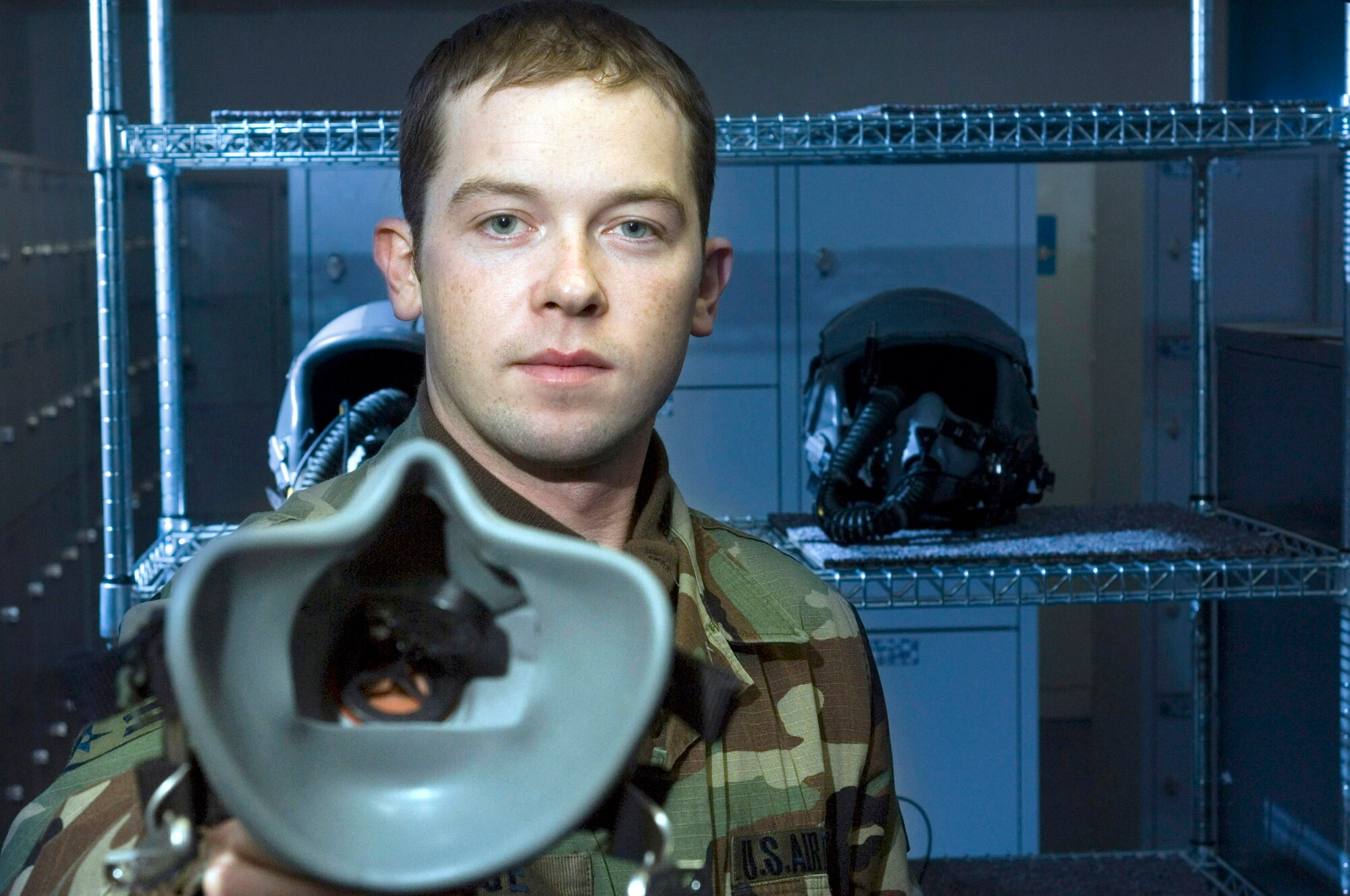 RAMSTEIN AIR BASE, Germany (AFPN) -- Staff Sgt. Joshua Page fits a face mask onto aircrew member. The life support section keeps all aircrew gear ready. Night vision goggles, parachutes and survival vests are just a few of the items they maintain. Sergeant Page is a life support journeyman with the 37th Airlift Squadron and is from Las Vegas. (U.S. Air Force photo by Master Sgt. John E. Lasky)
